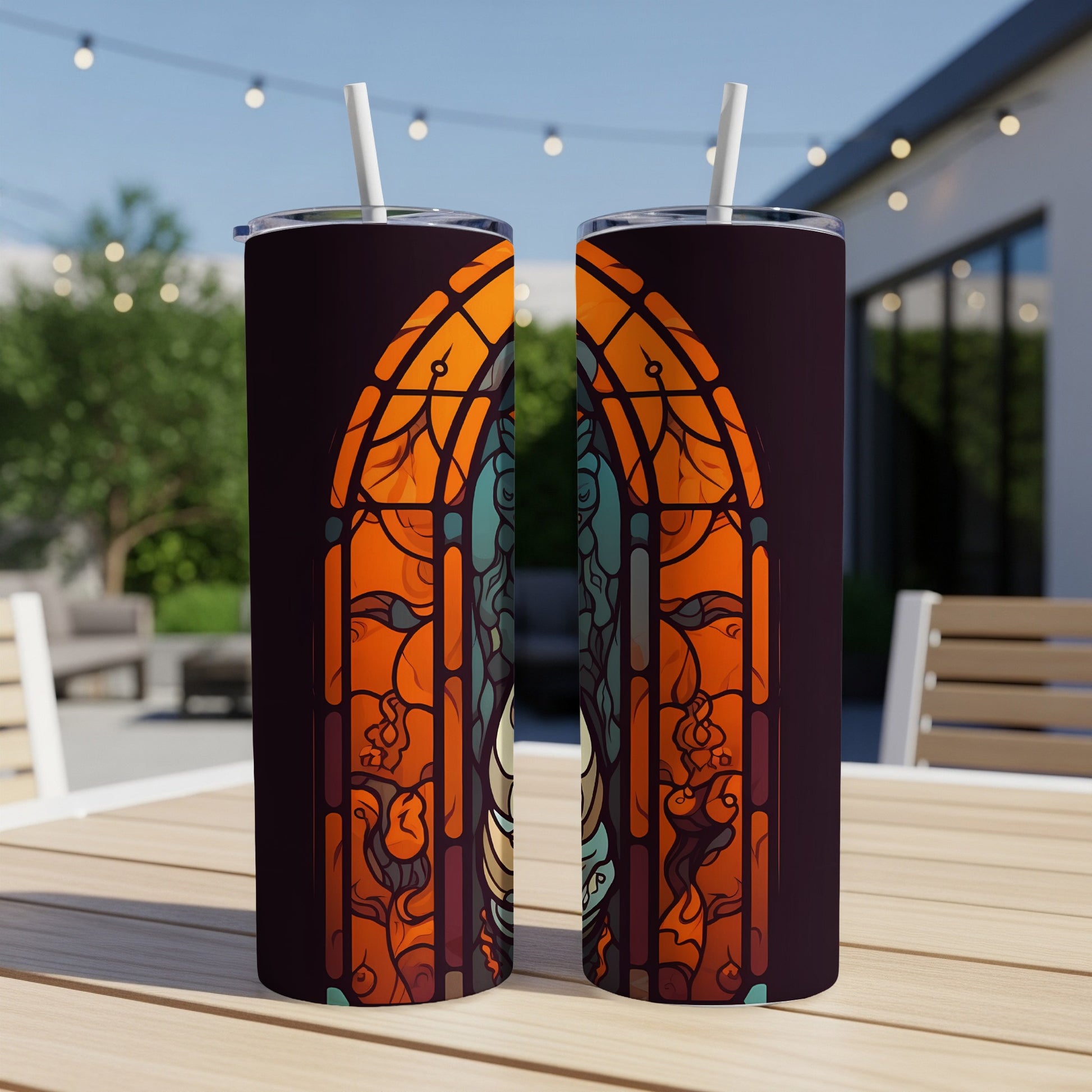 Two tumblers with stained glass-style art featuring a skeleton.