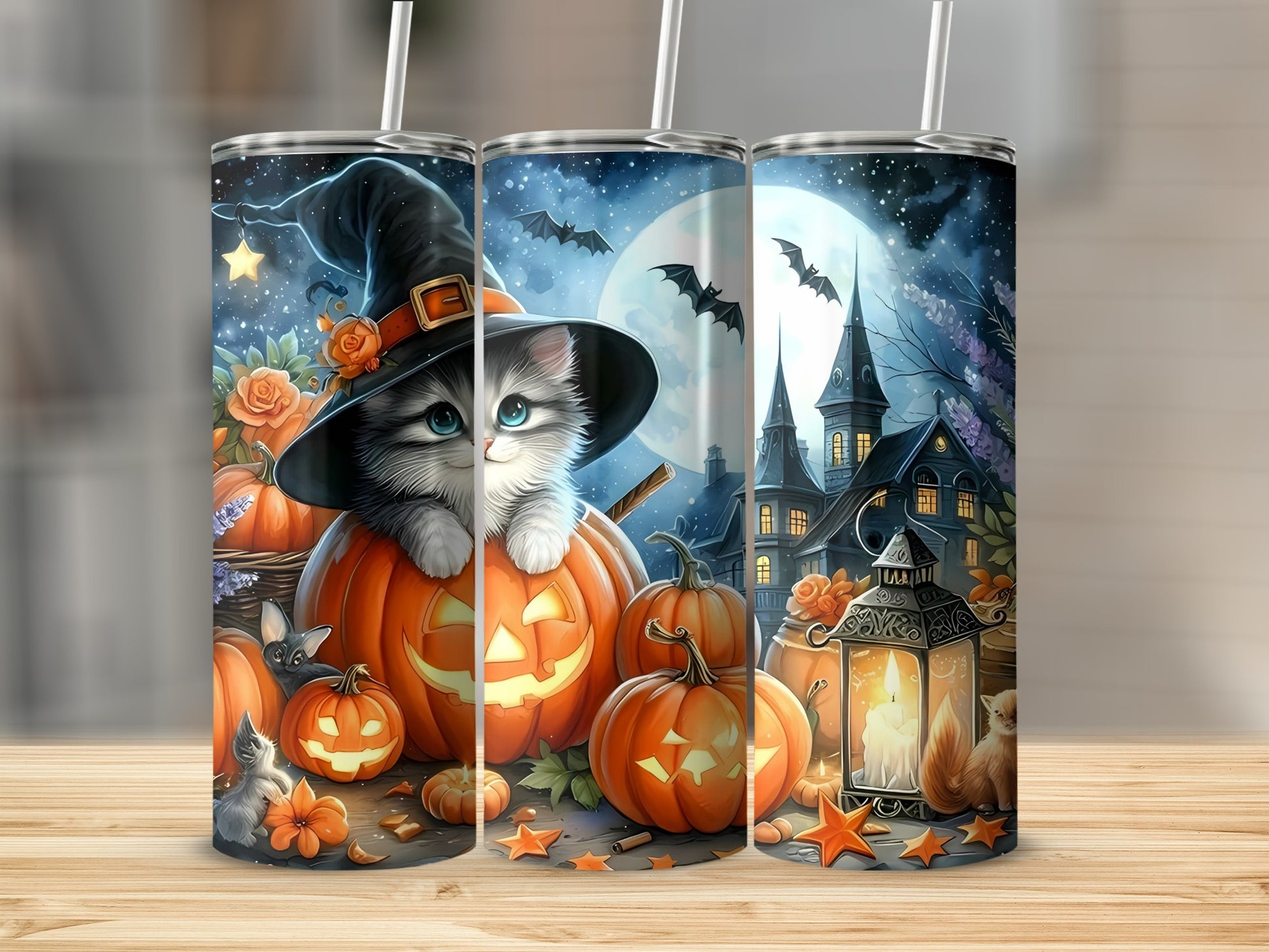 Halloween tumblers with kitten in witch hat and pumpkins, bats, and spooky houses.