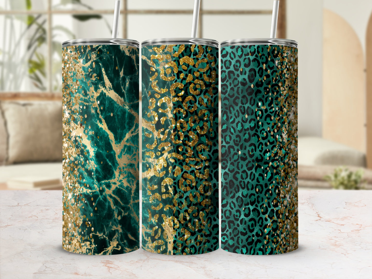 Three teal and gold glitter tumblers with marble and leopard print patterns.