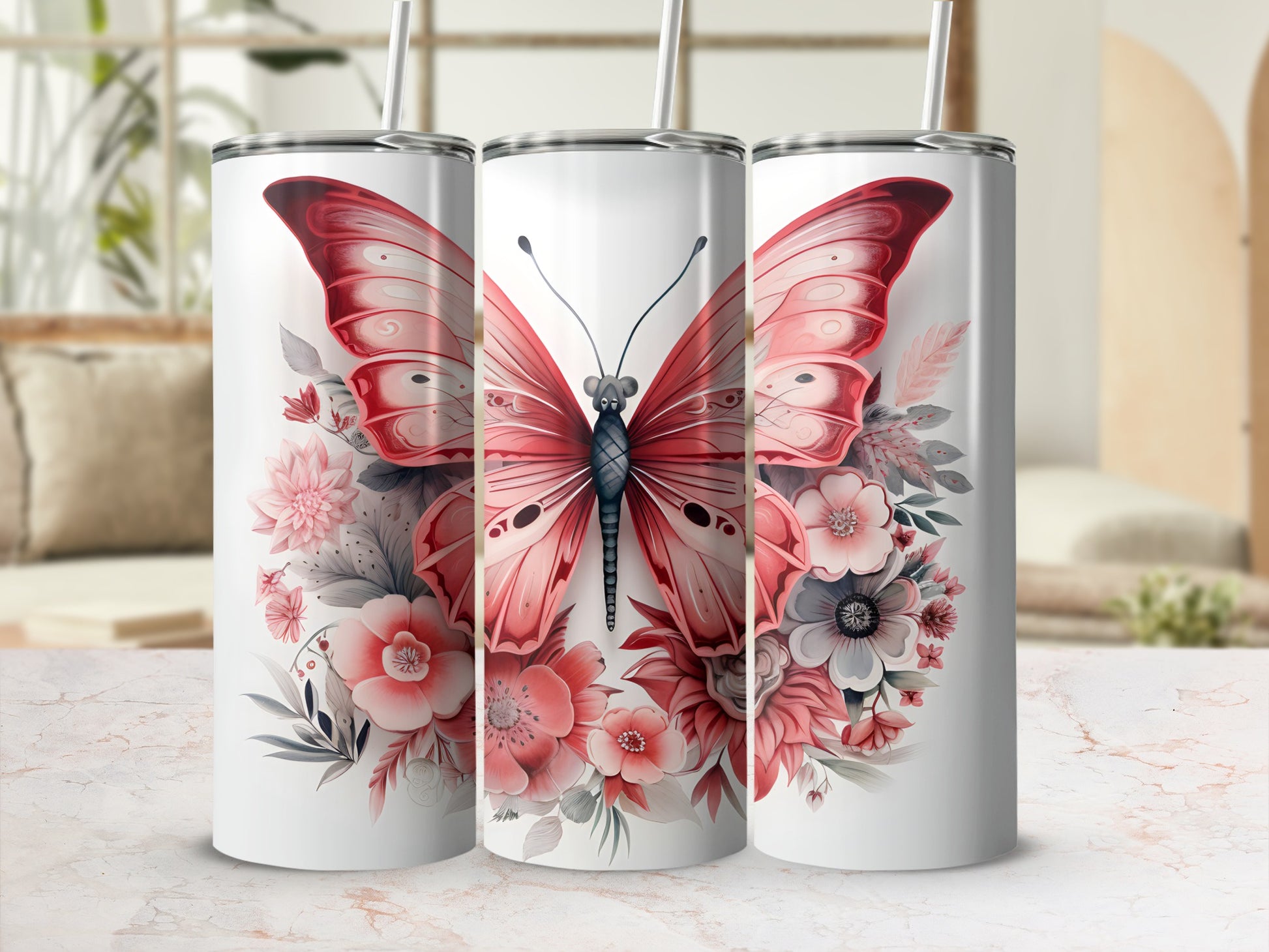 Three tumblers featuring a large pink butterfly surrounded by floral elements.