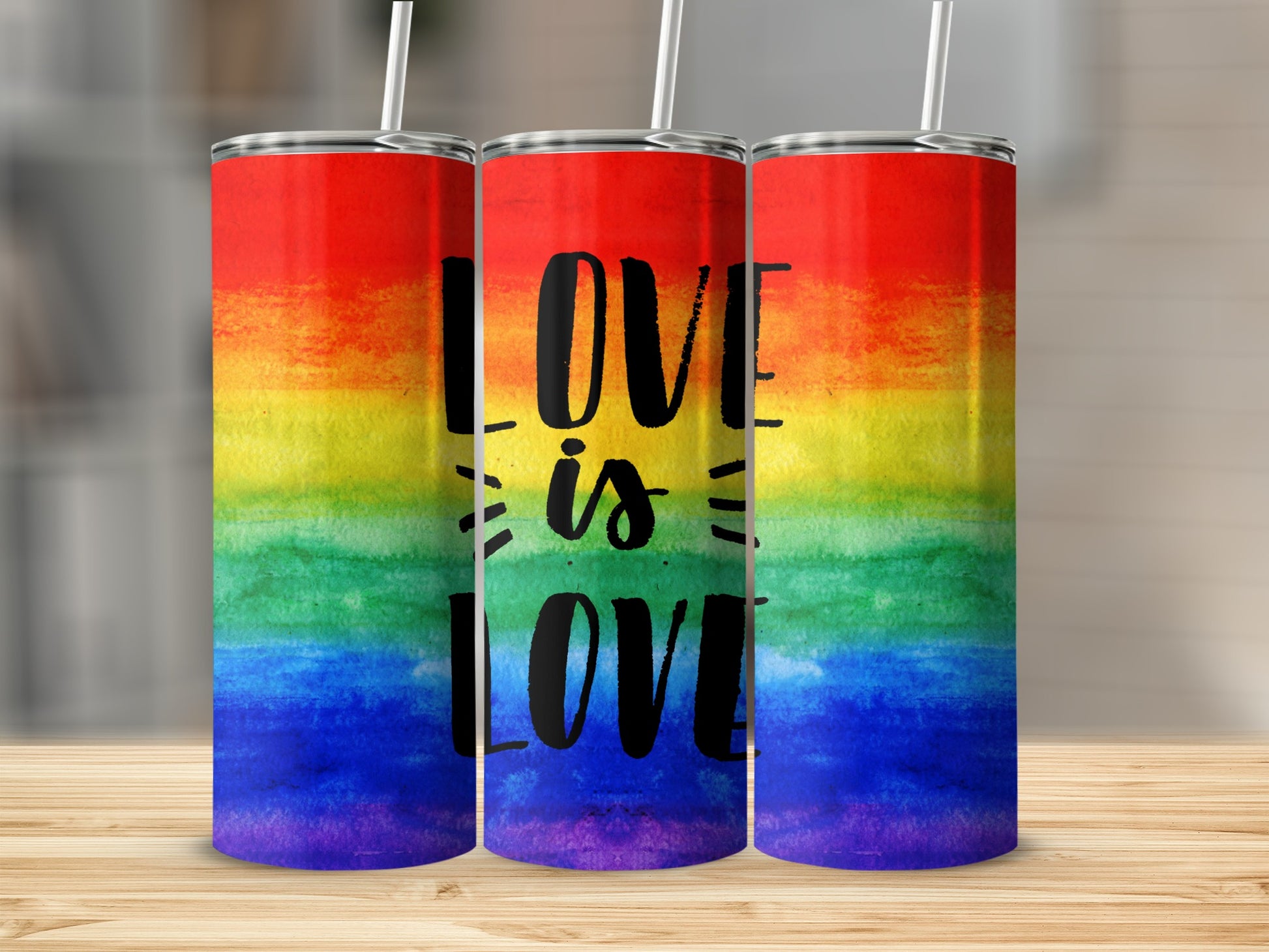 Rainbow watercolor tumbler with "Love is Love" text.