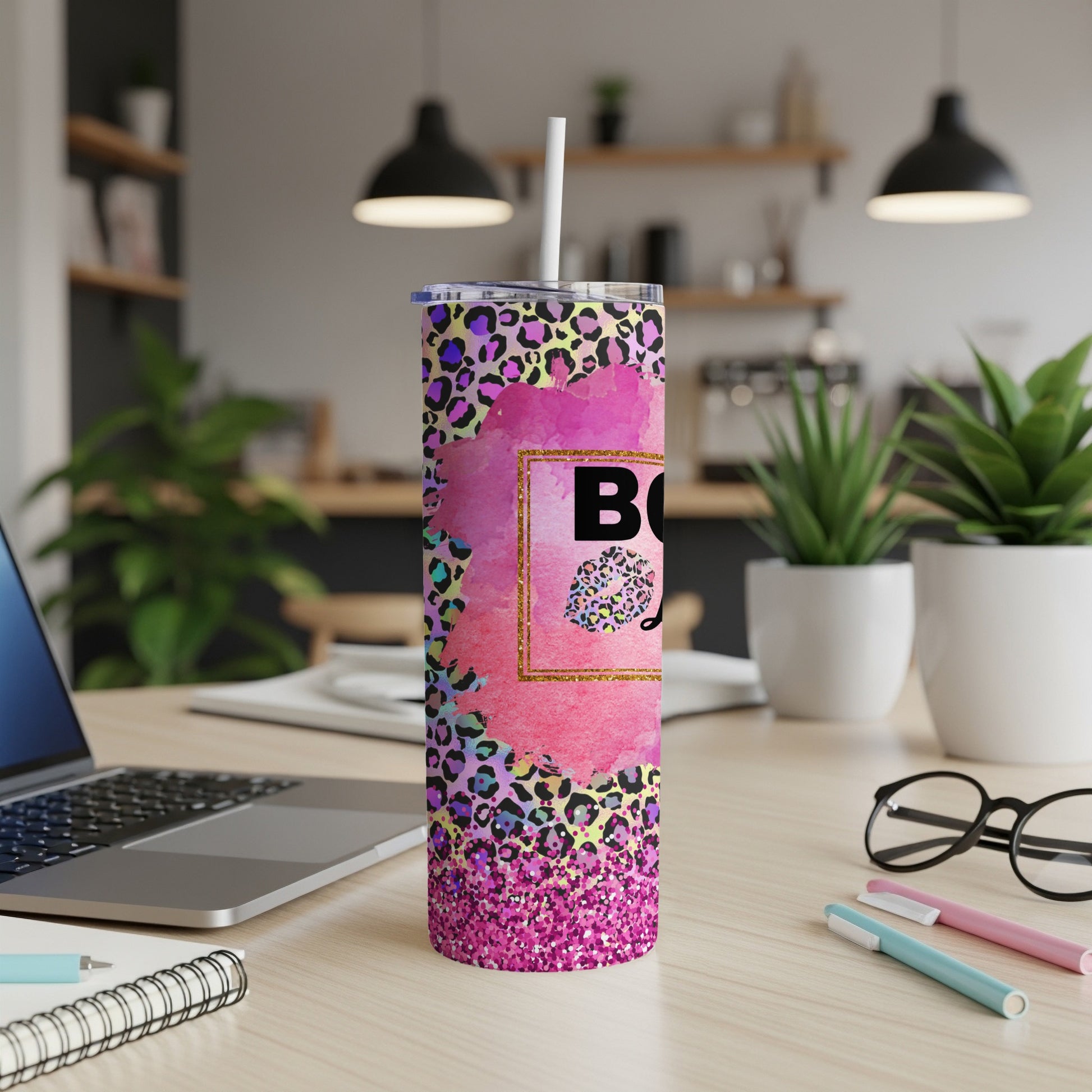 Pink and purple leopard print tumbler with "Boss Babe" text on a desk.