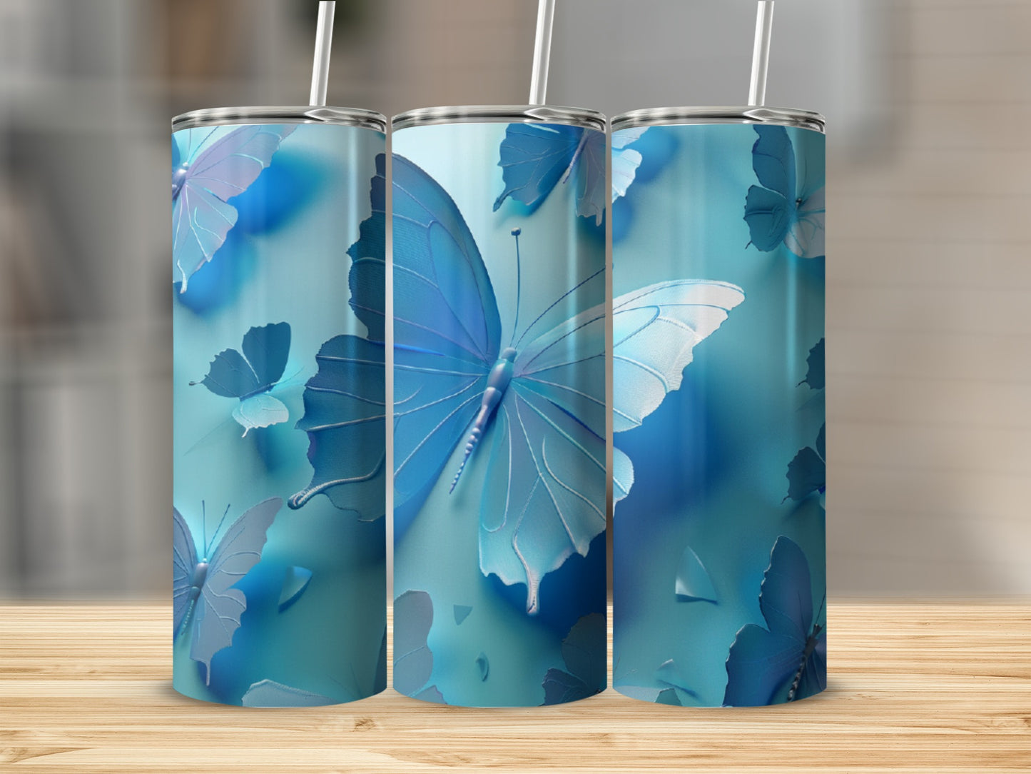 Blue butterflies on a tumbler mockup with a wooden background.