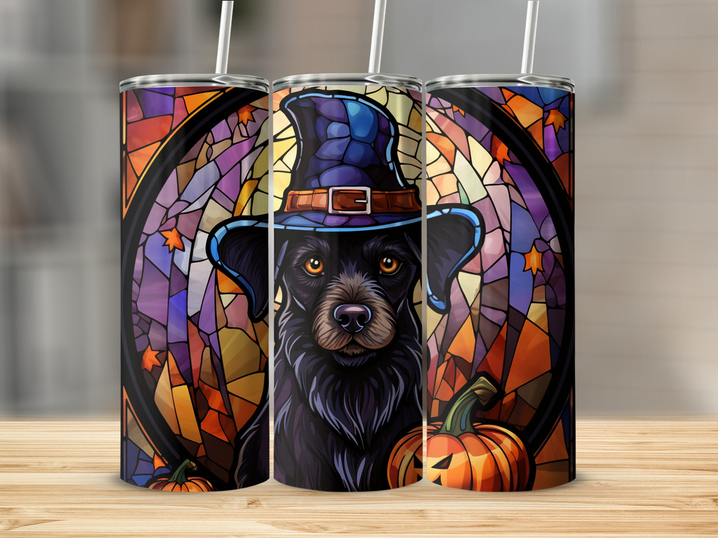 Black dog wearing a witch hat with stained glass and pumpkin pattern.