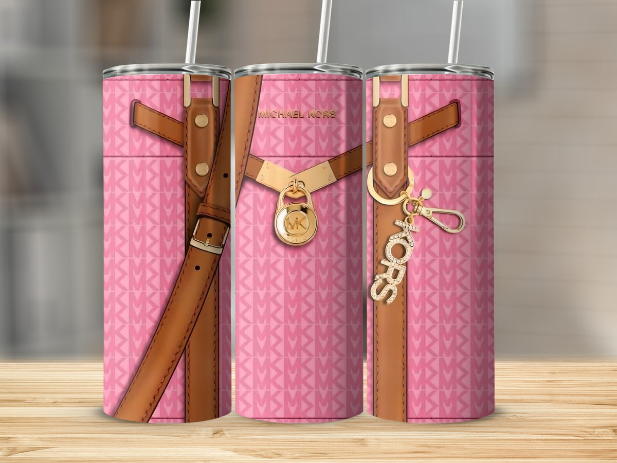 Pink Michael Kors tumbler with repeating logo pattern and gold accents.