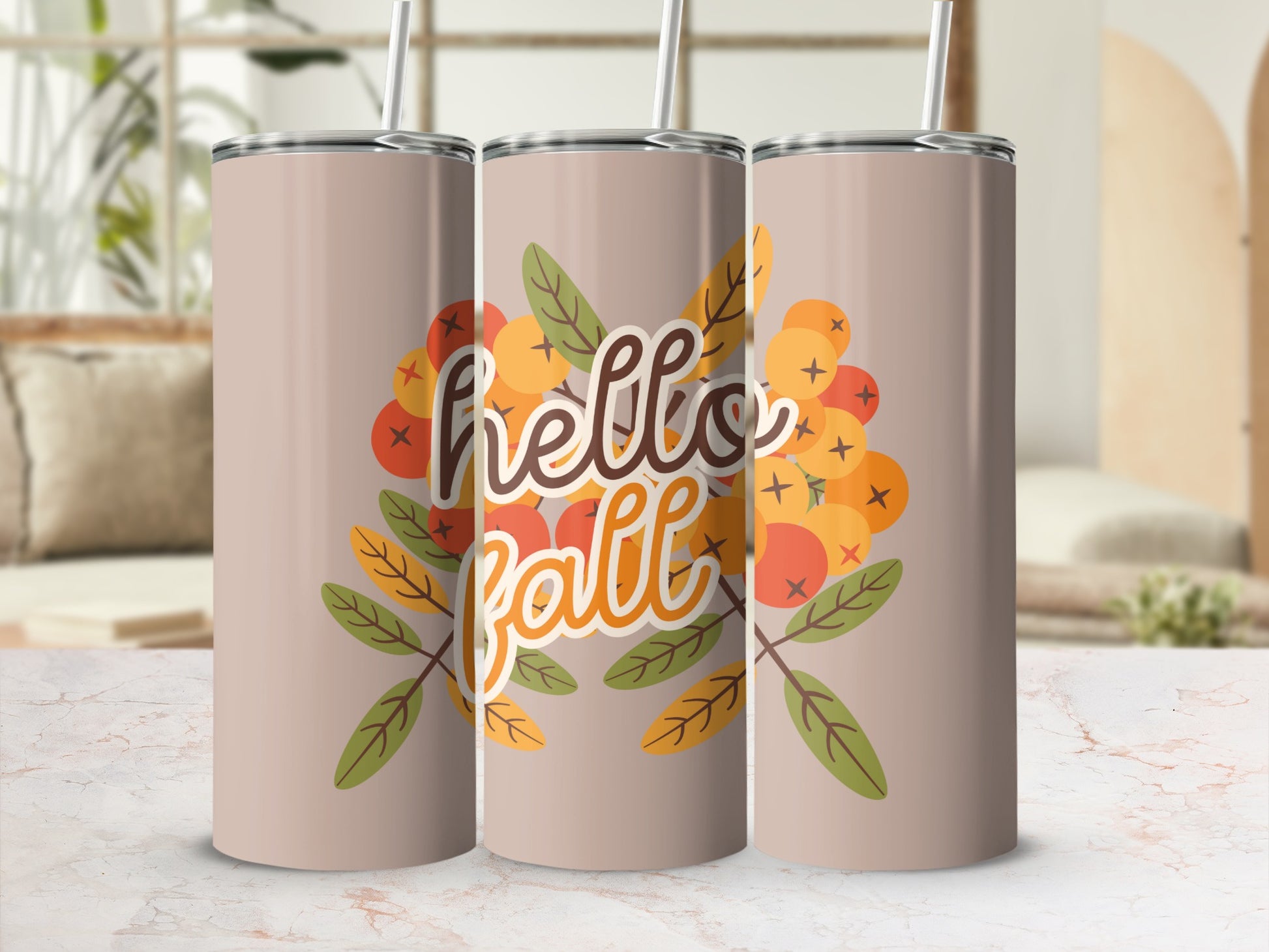 Three tan tumblers with "hello fall" and autumn leaf graphics.
