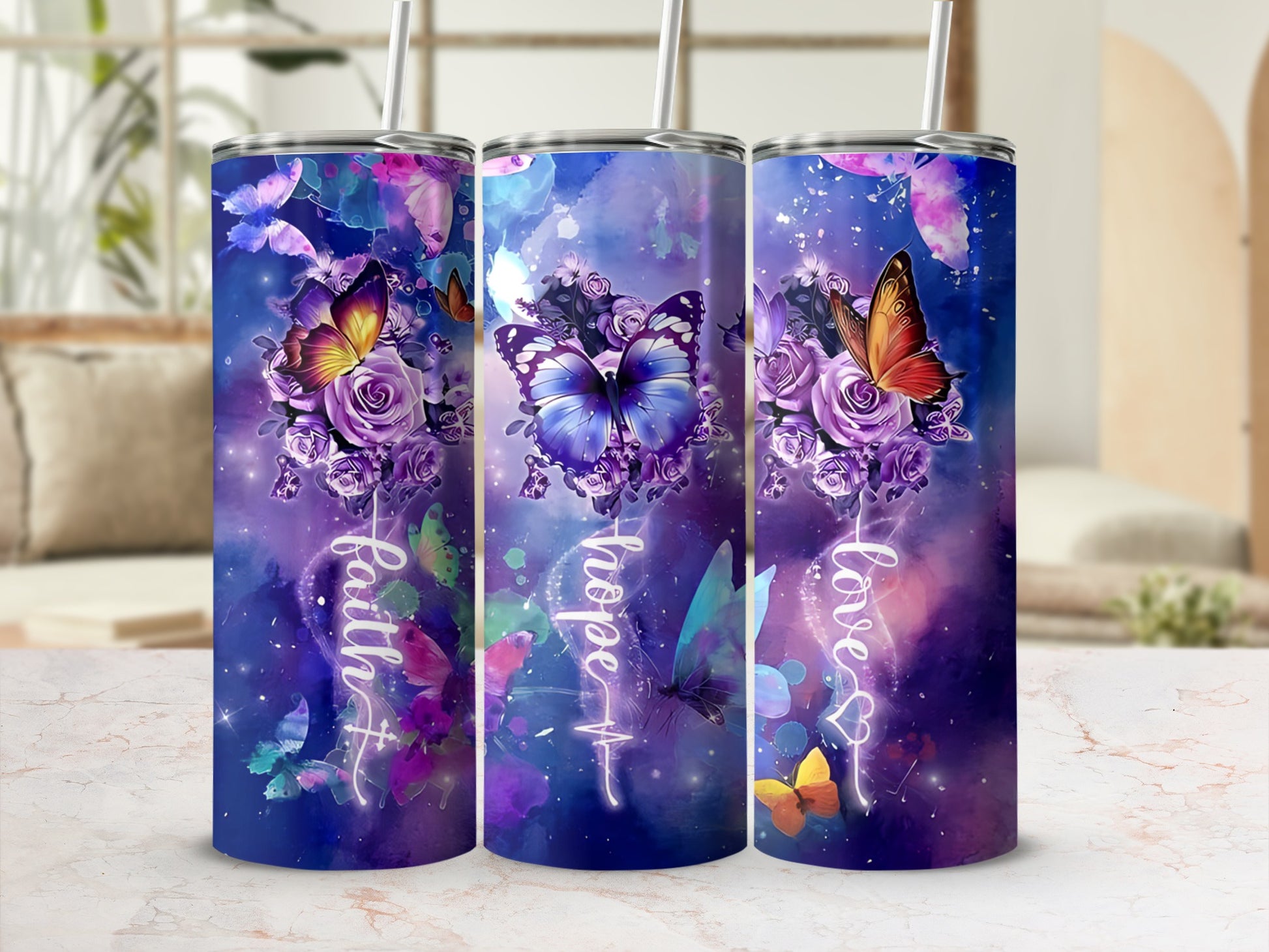 Three tumblers with butterfly and floral designs and text "faith", "hope", "love".