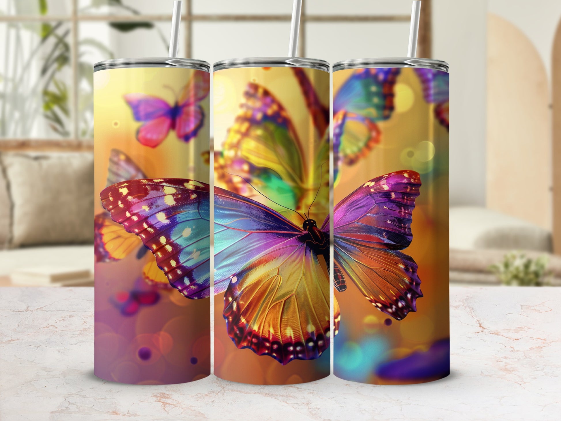 Three tumblers with colorful butterfly designs and bokeh background.