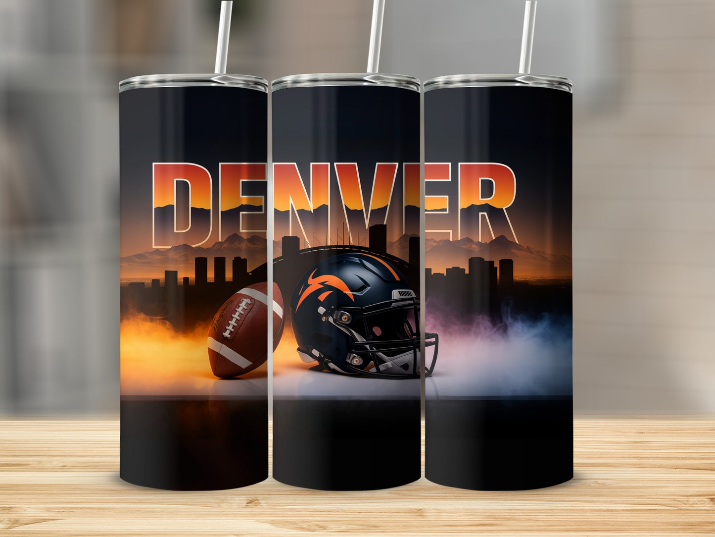 Denver Broncos football helmet and ball on smoky cityscape background.