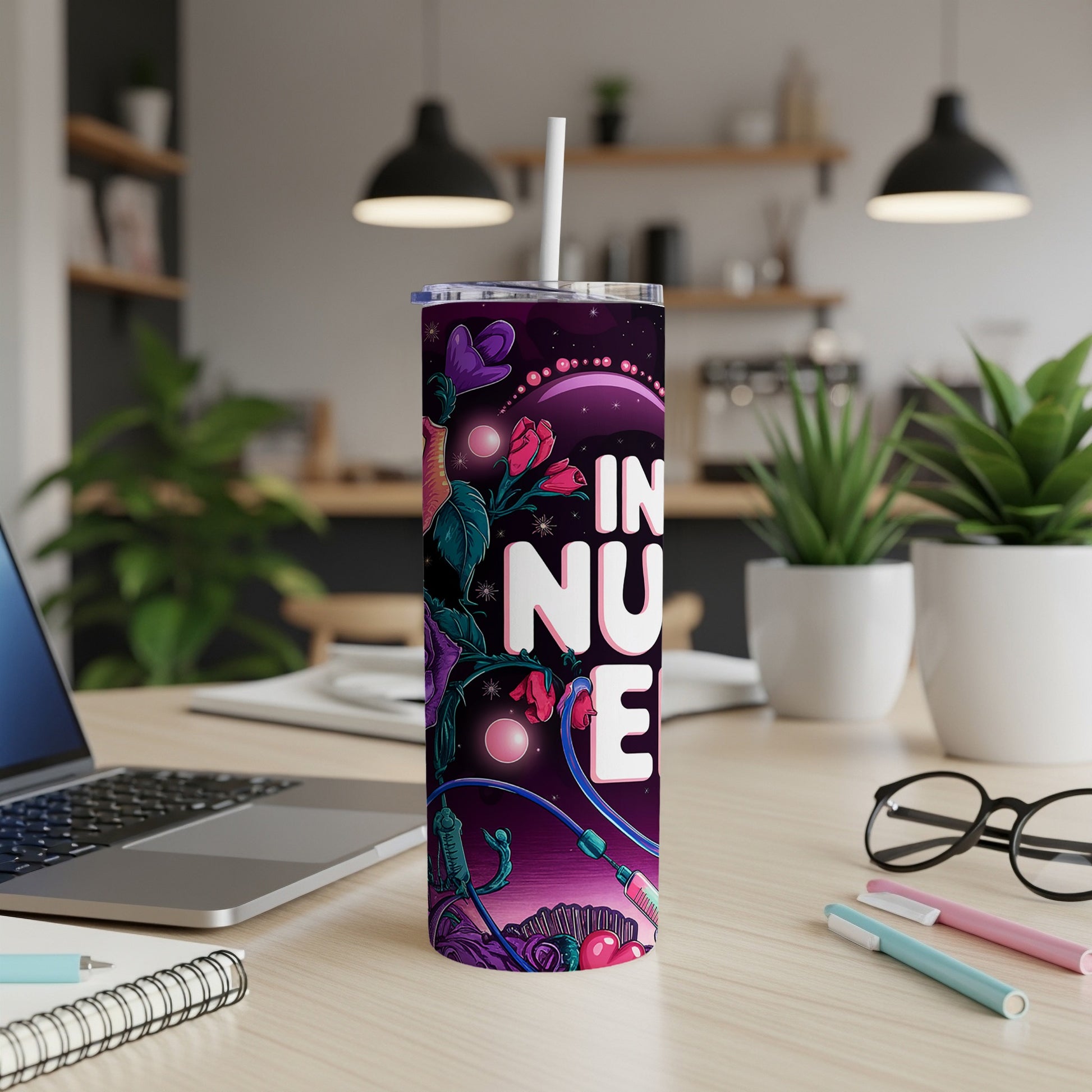Purple tumbler with "IN NUSE" text and floral, alien-like design.