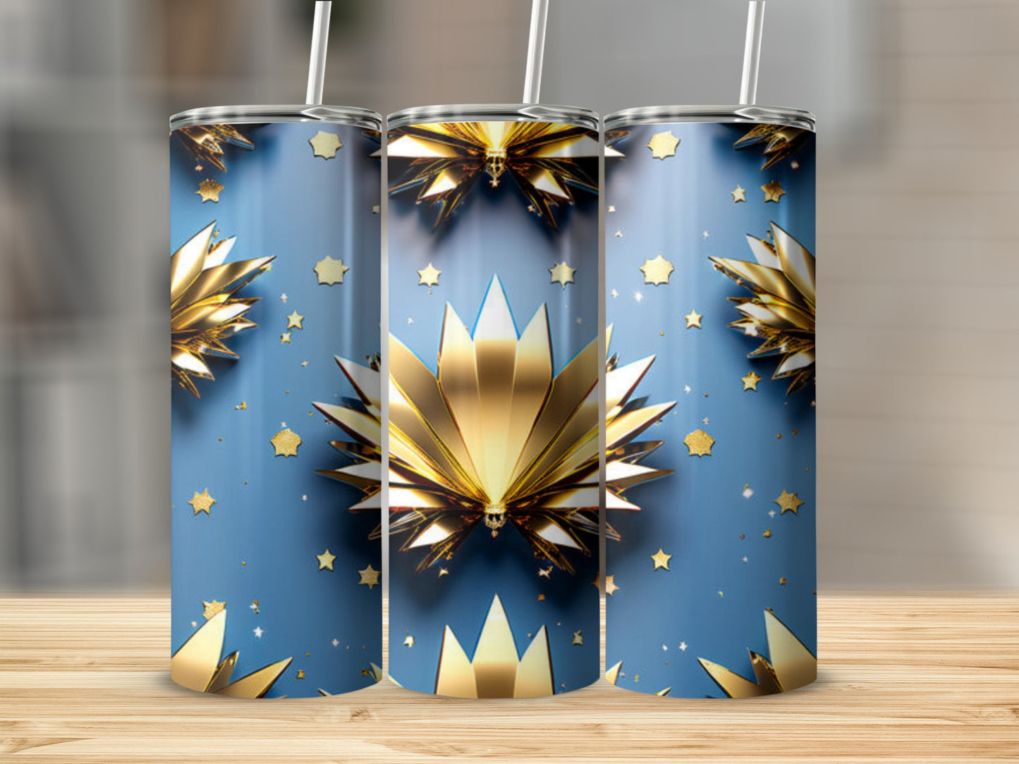 Gold starburst pattern on blue tumbler with straw.