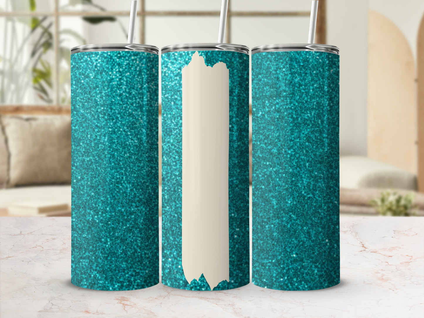 Glittering turquoise tumbler with a cream stripe on a marble surface.