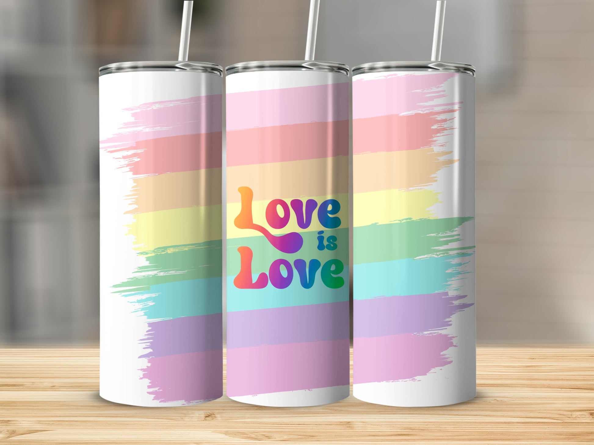 Rainbow stripes on three tumblers with "Love is Love" text.