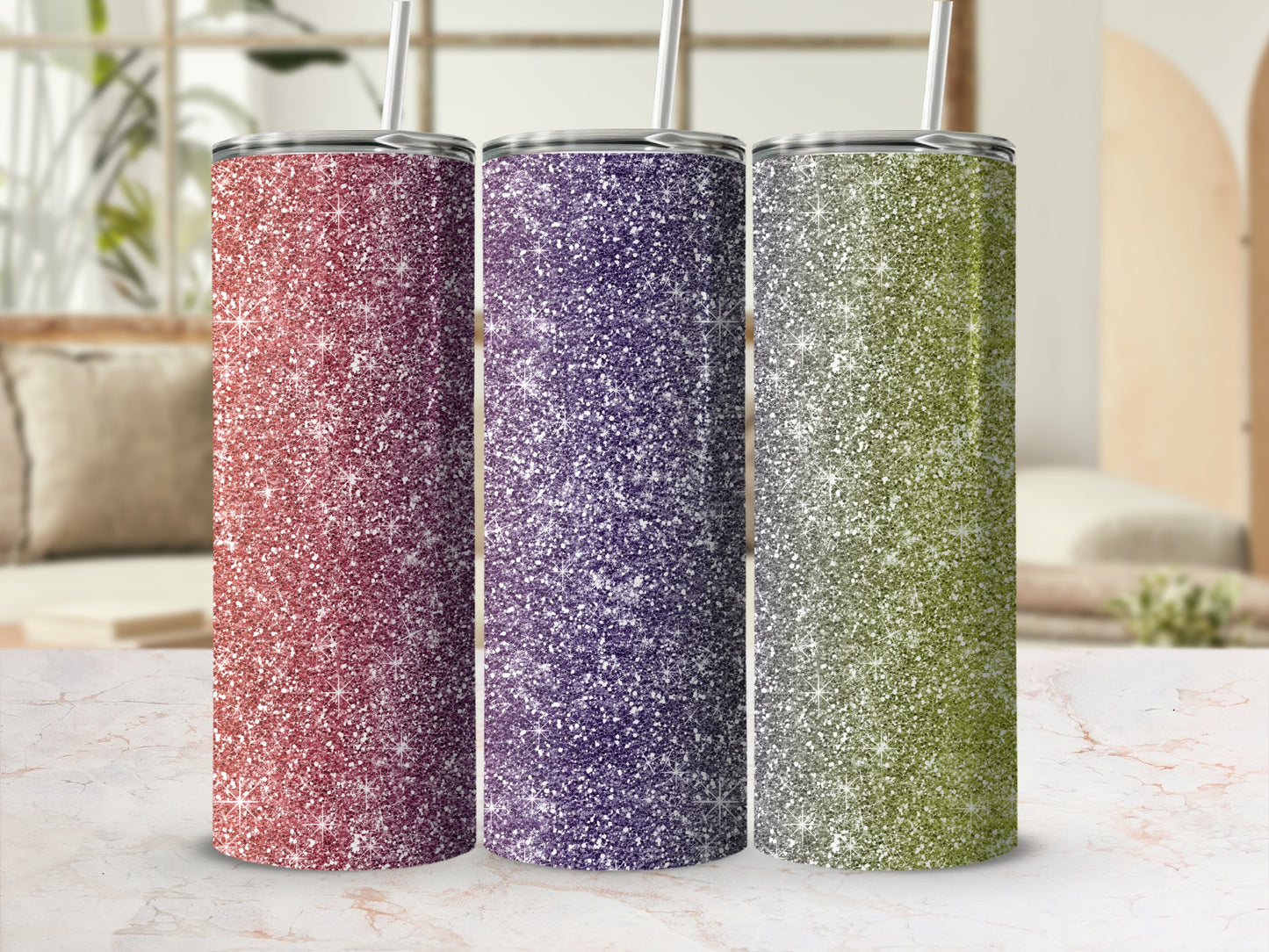 Three glitter tumblers in red, purple, and green stand upright.