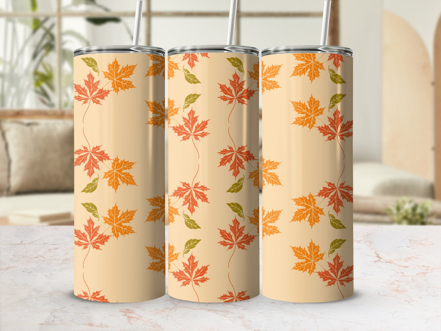 Beige tumbler with repeating pattern of orange and green maple leaves.