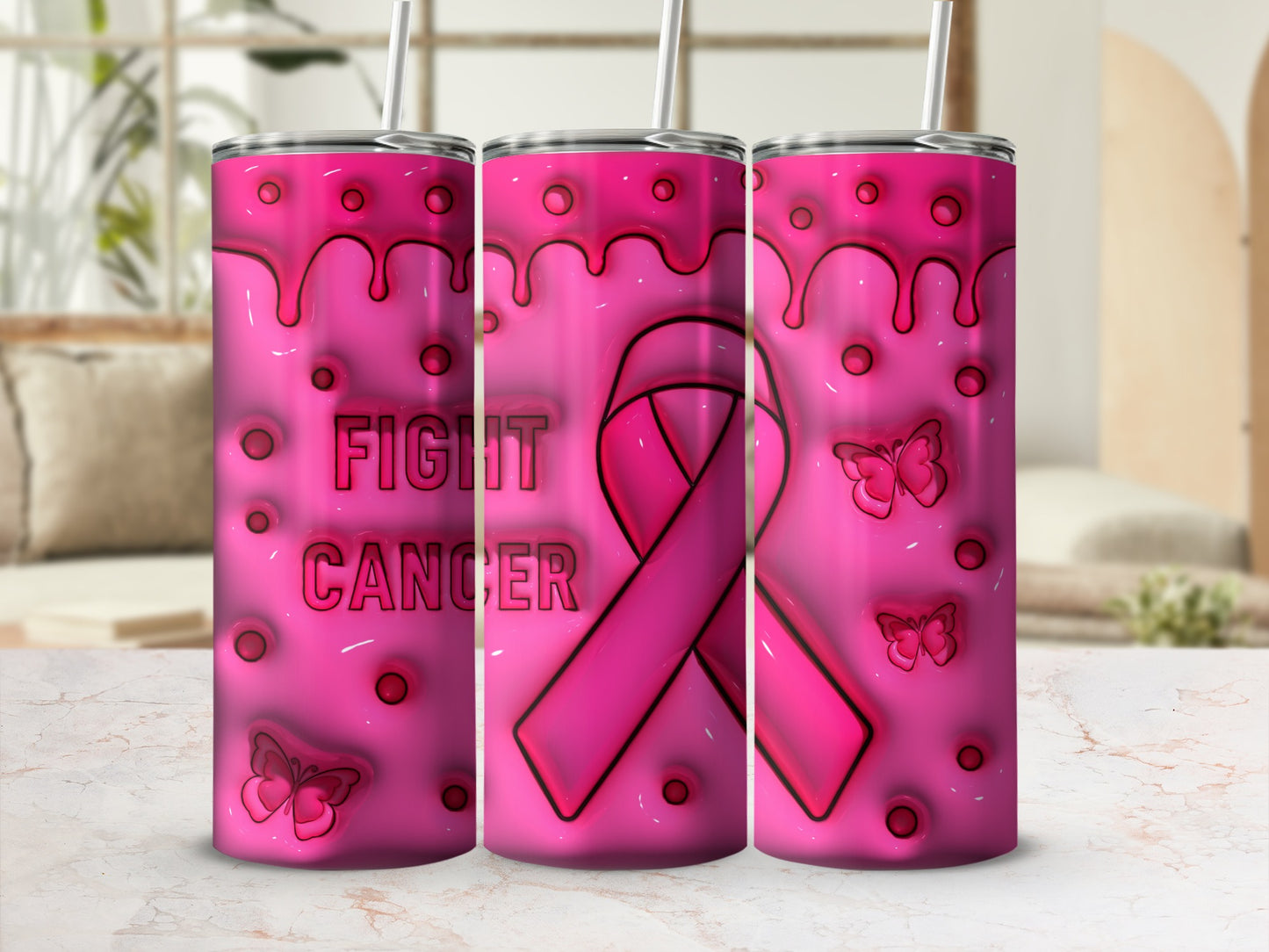 Pink tumbler with "Fight Cancer" text and a ribbon, against a blurred background.