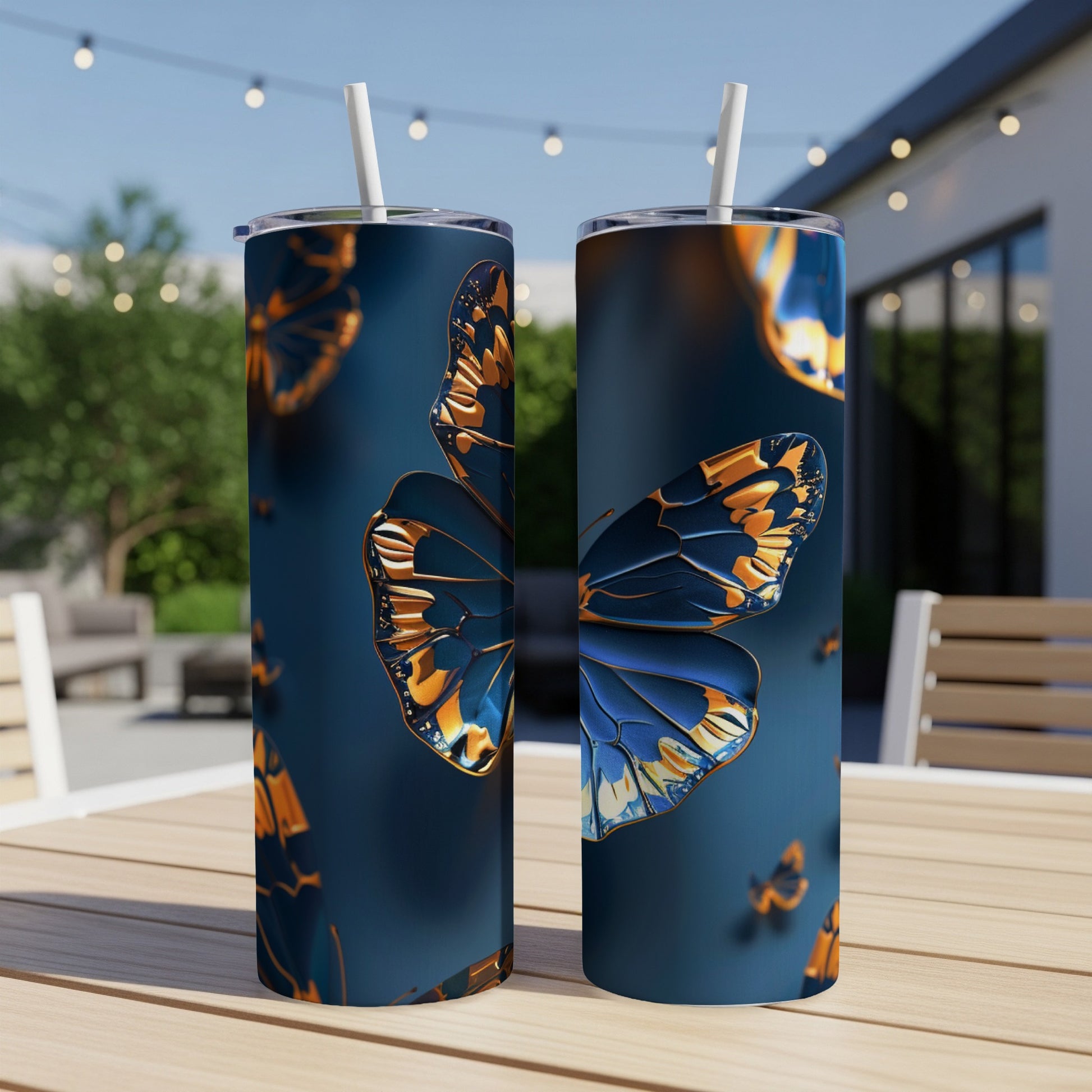 Two dark tumblers with a metallic blue and orange butterfly design.