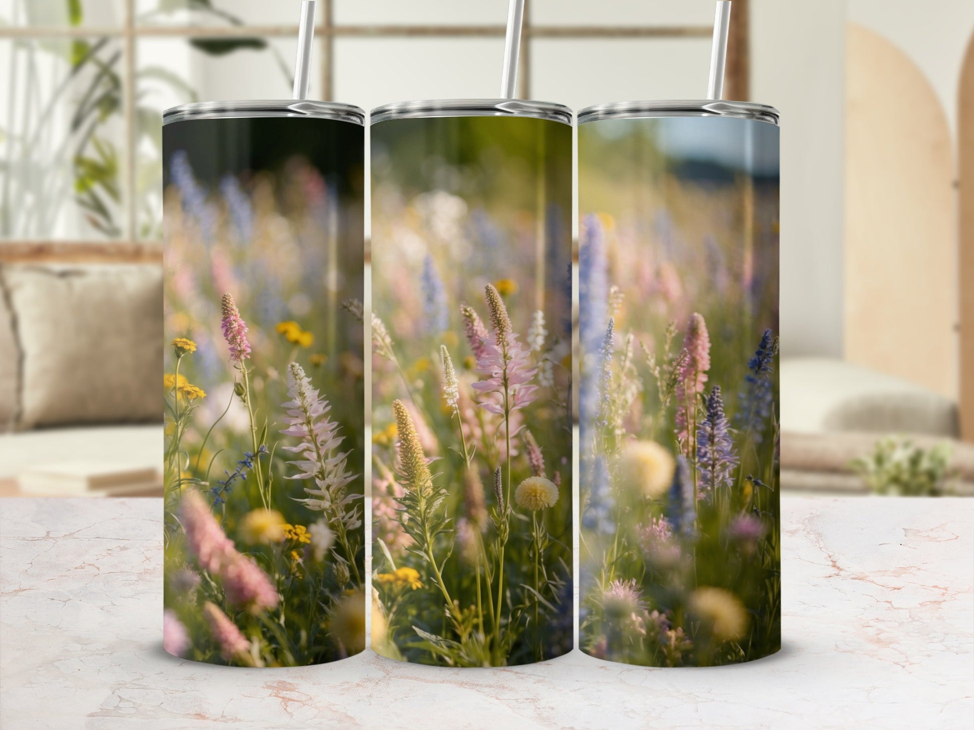 Three tumblers with a pastel floral meadow design.