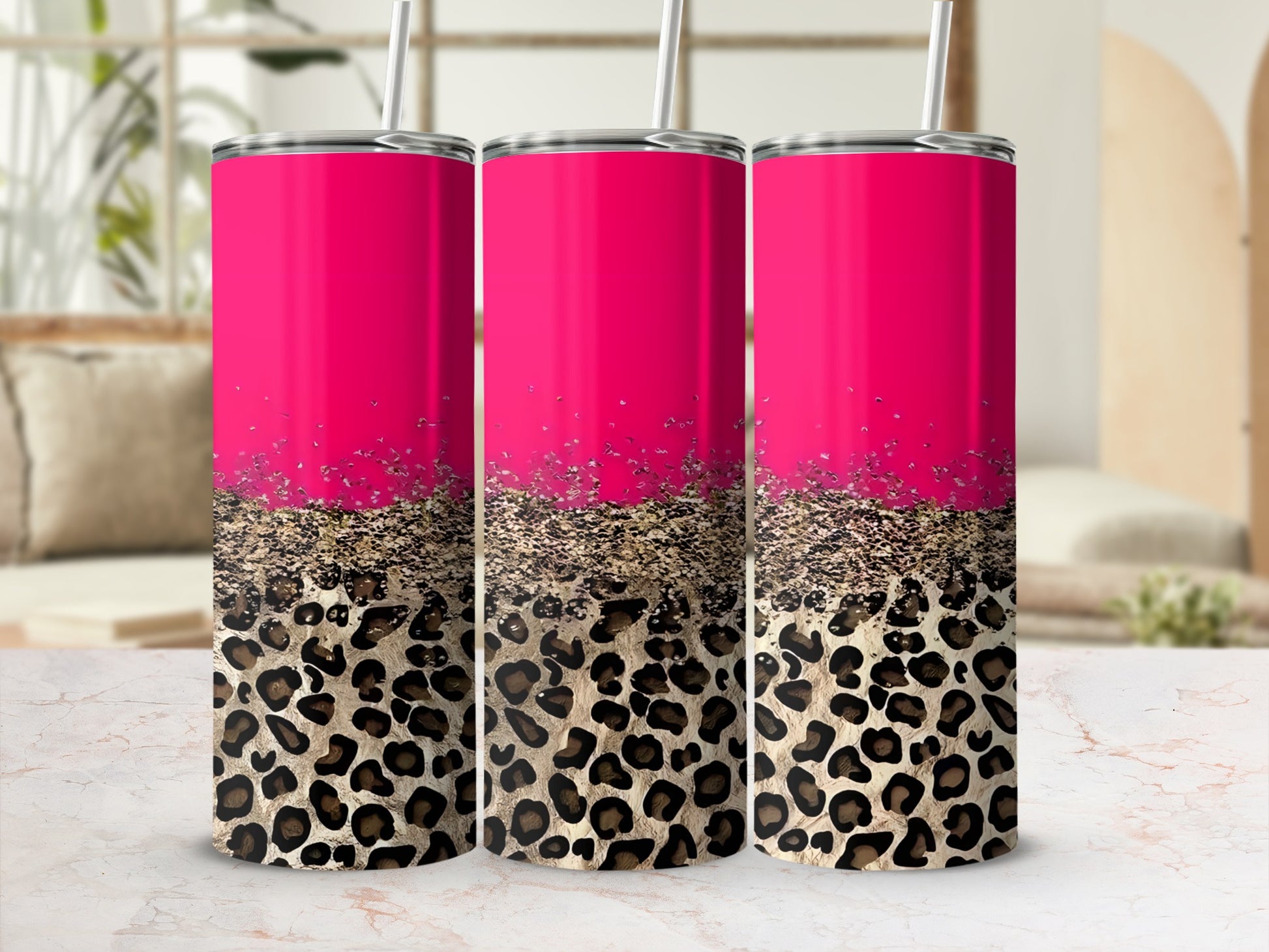 Three pink tumblers with leopard print at the bottom.