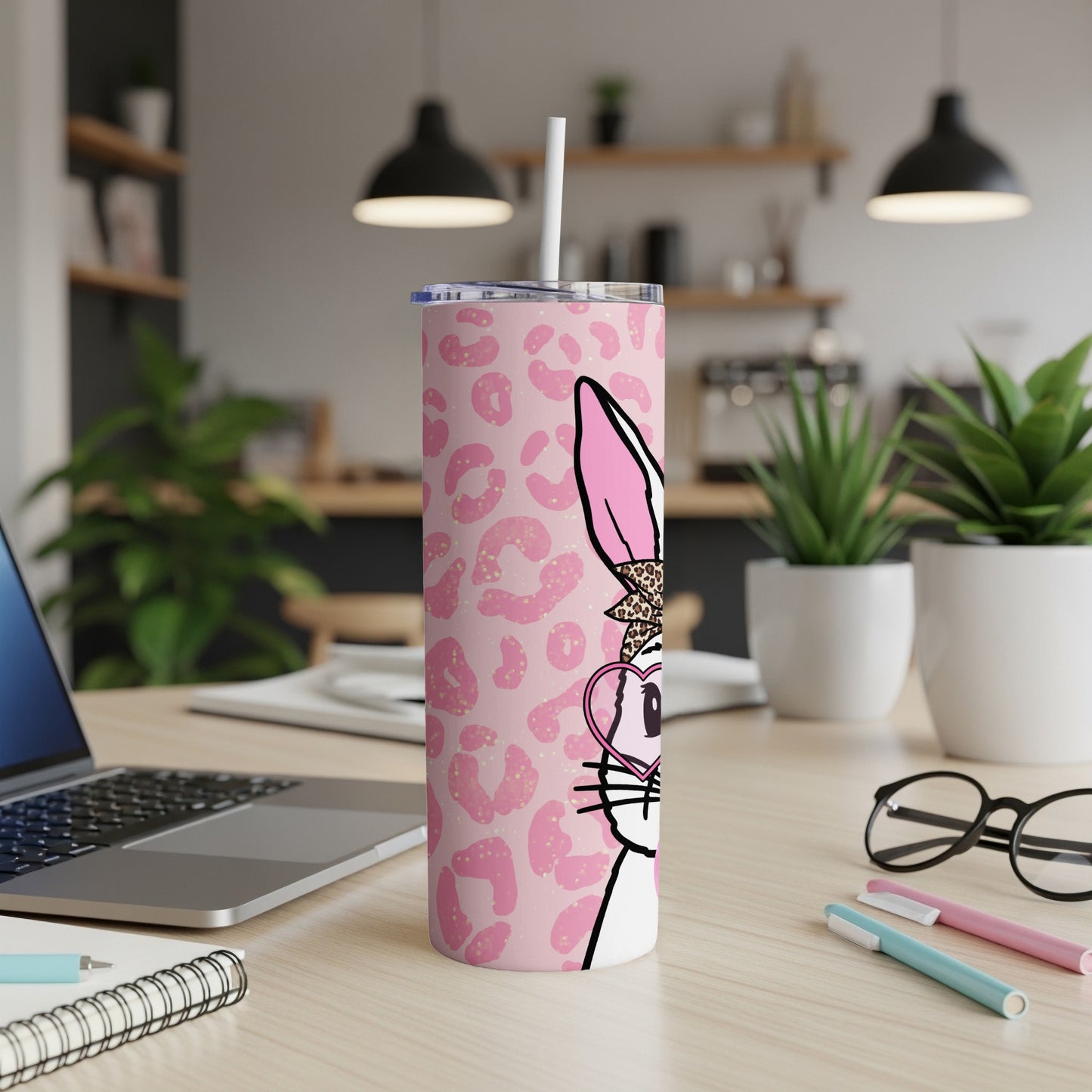 Pink leopard print tumbler with cartoon bunny wearing heart glasses.