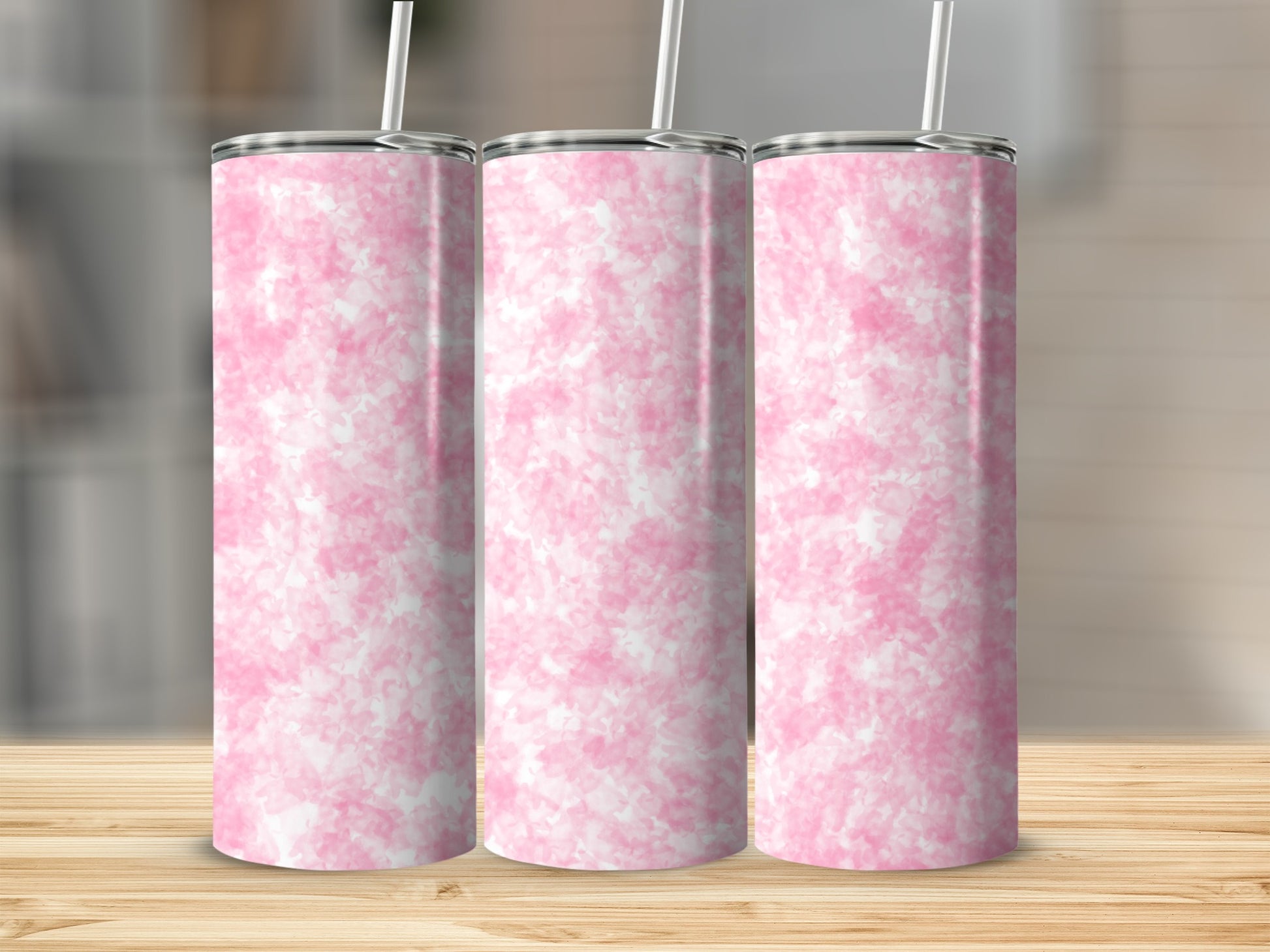 Three tall tumblers with pink and white watercolor patterns.
