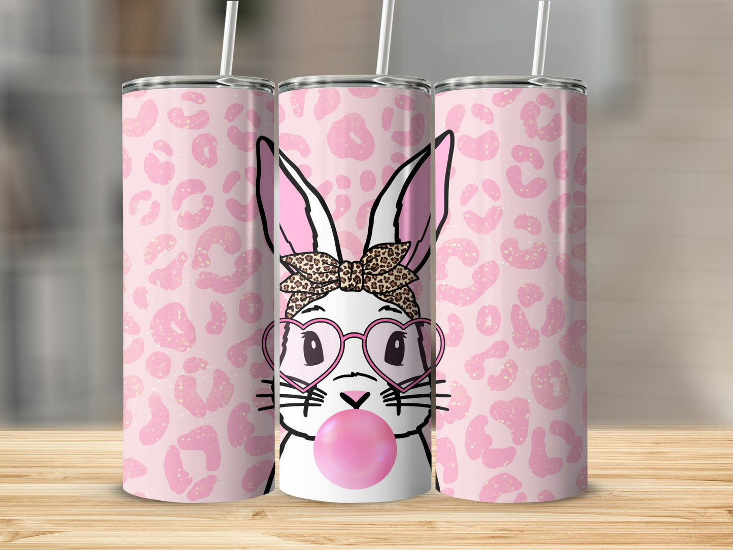 Bunny in heart glasses blowing bubblegum, pink leopard print tumbler.