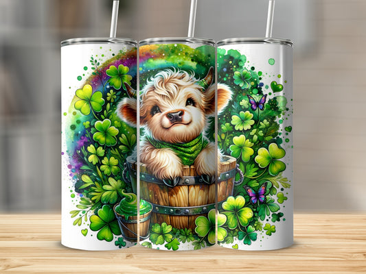Cute calf in a barrel surrounded by shamrocks and butterflies.