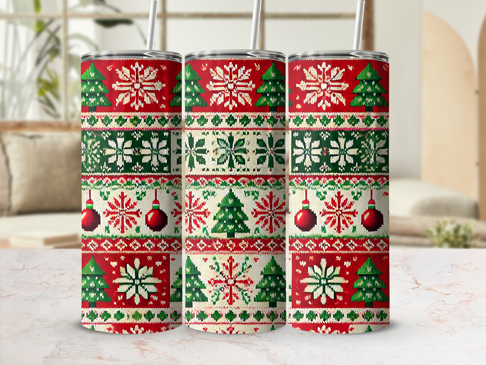 Three Christmas-themed tumblers with snowflake and tree patterns.