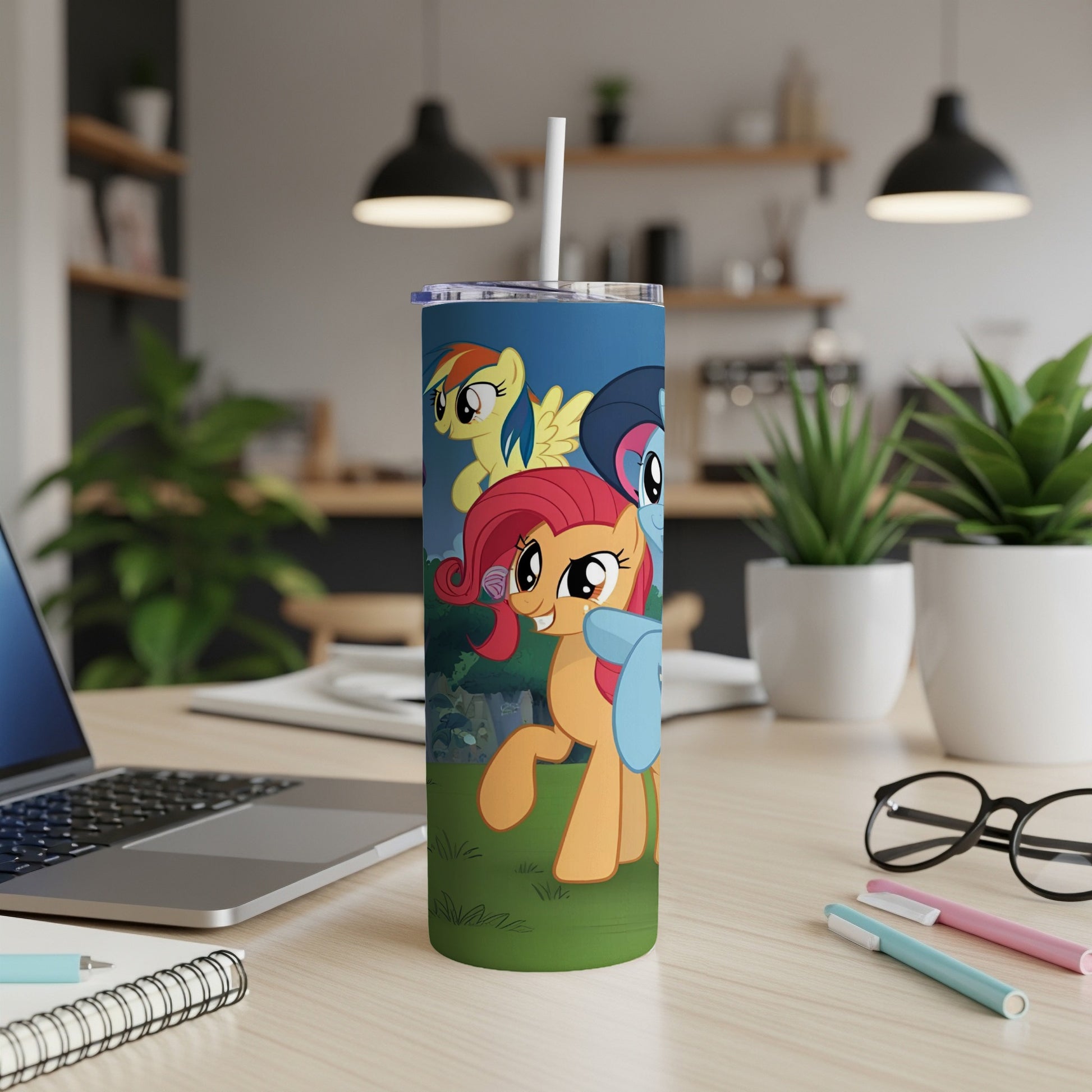 My Little Pony characters on a blue tumbler with a straw.