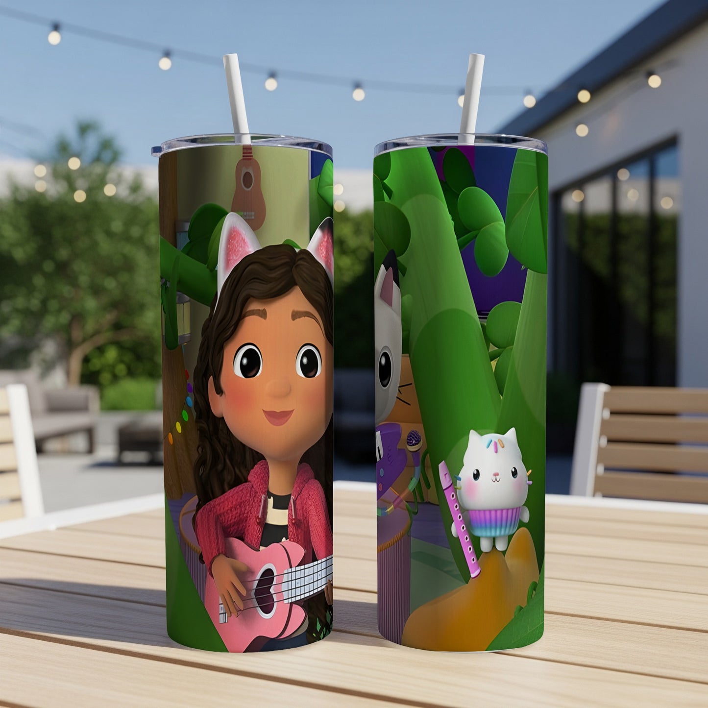 Gabby's Dollhouse tumbler with Gabby playing guitar and Pandy Paws on a patio.