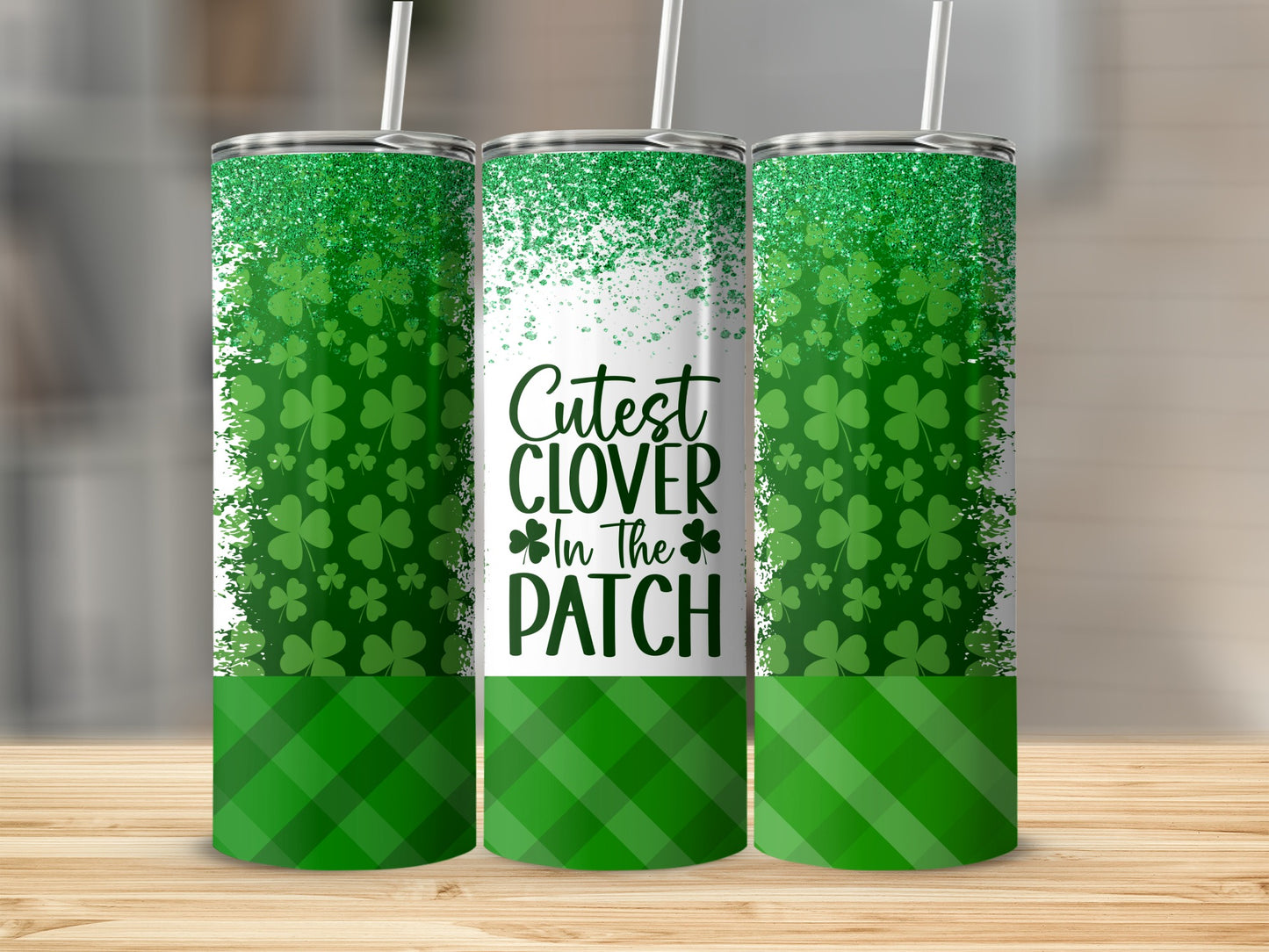 Tumbler with green shamrocks and "Cutest Clover in the Patch" text.