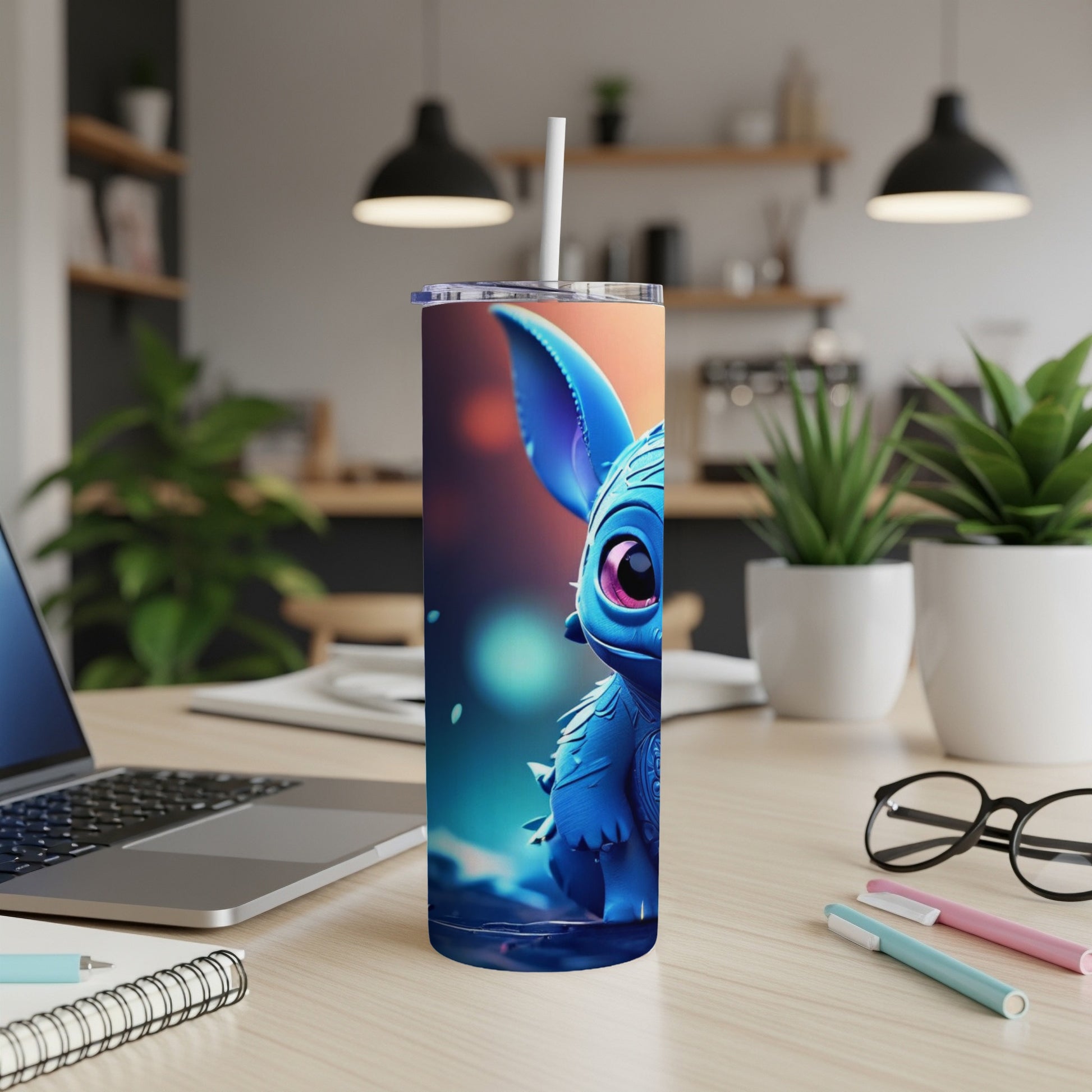 Blue alien character on a tall, narrow tumbler with a straw.