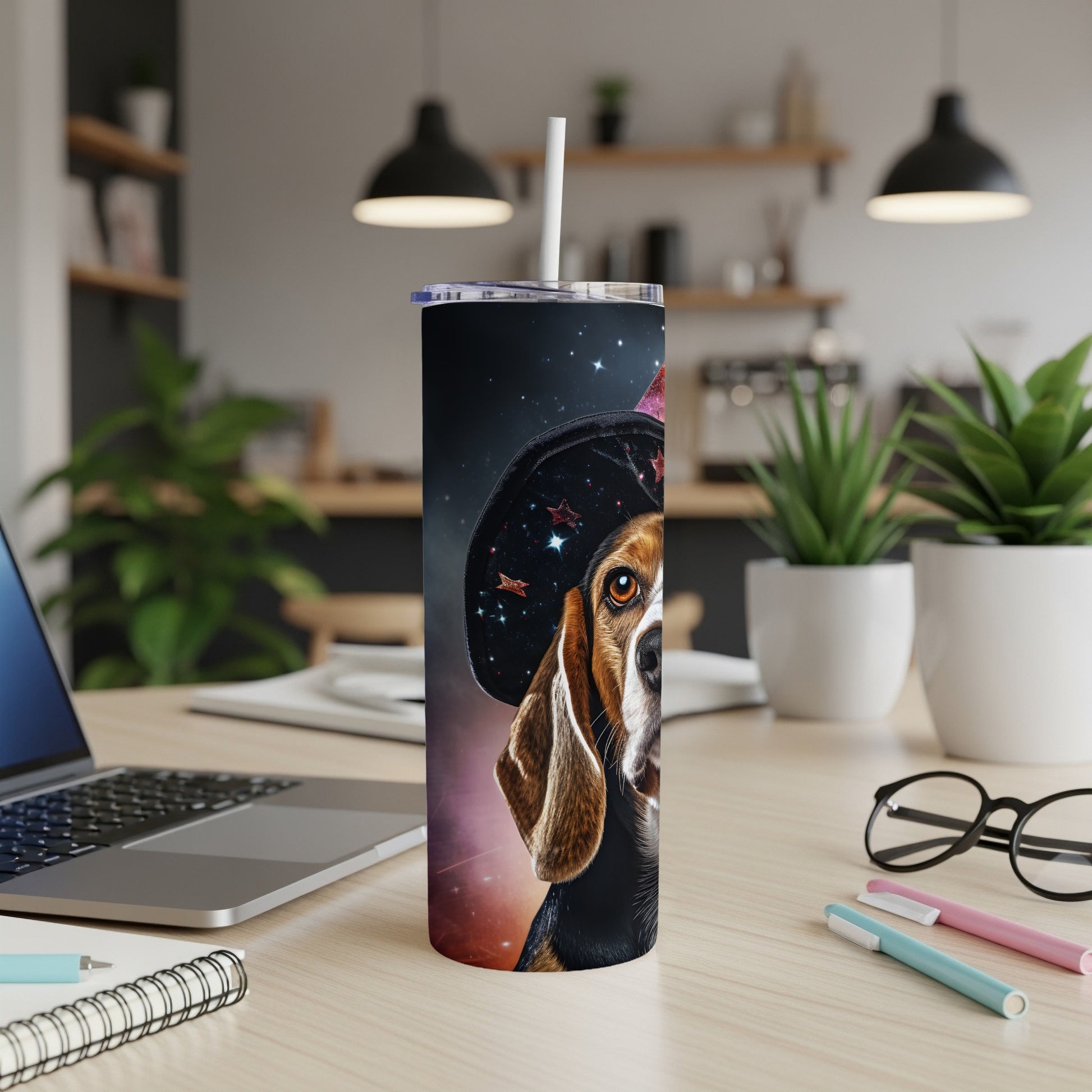 Beagle dog wearing a witch hat on a starry background, on a tumbler.