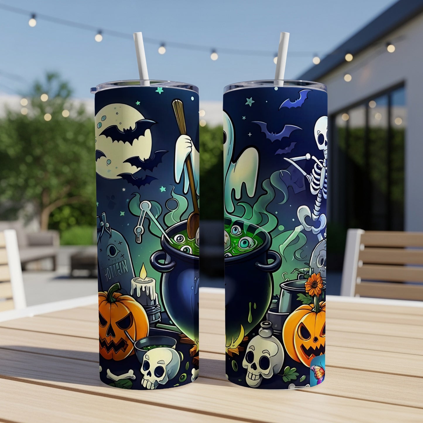 Two Halloween-themed tumblers with ghosts, skeletons, pumpkins, bats, and cauldrons.