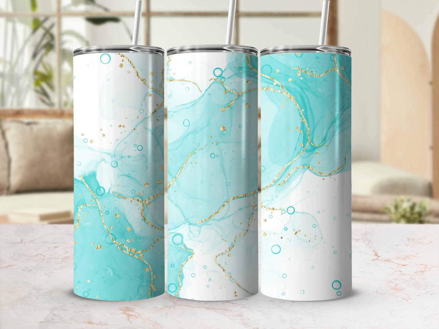 Three tumblers with teal and gold marbled abstract design.