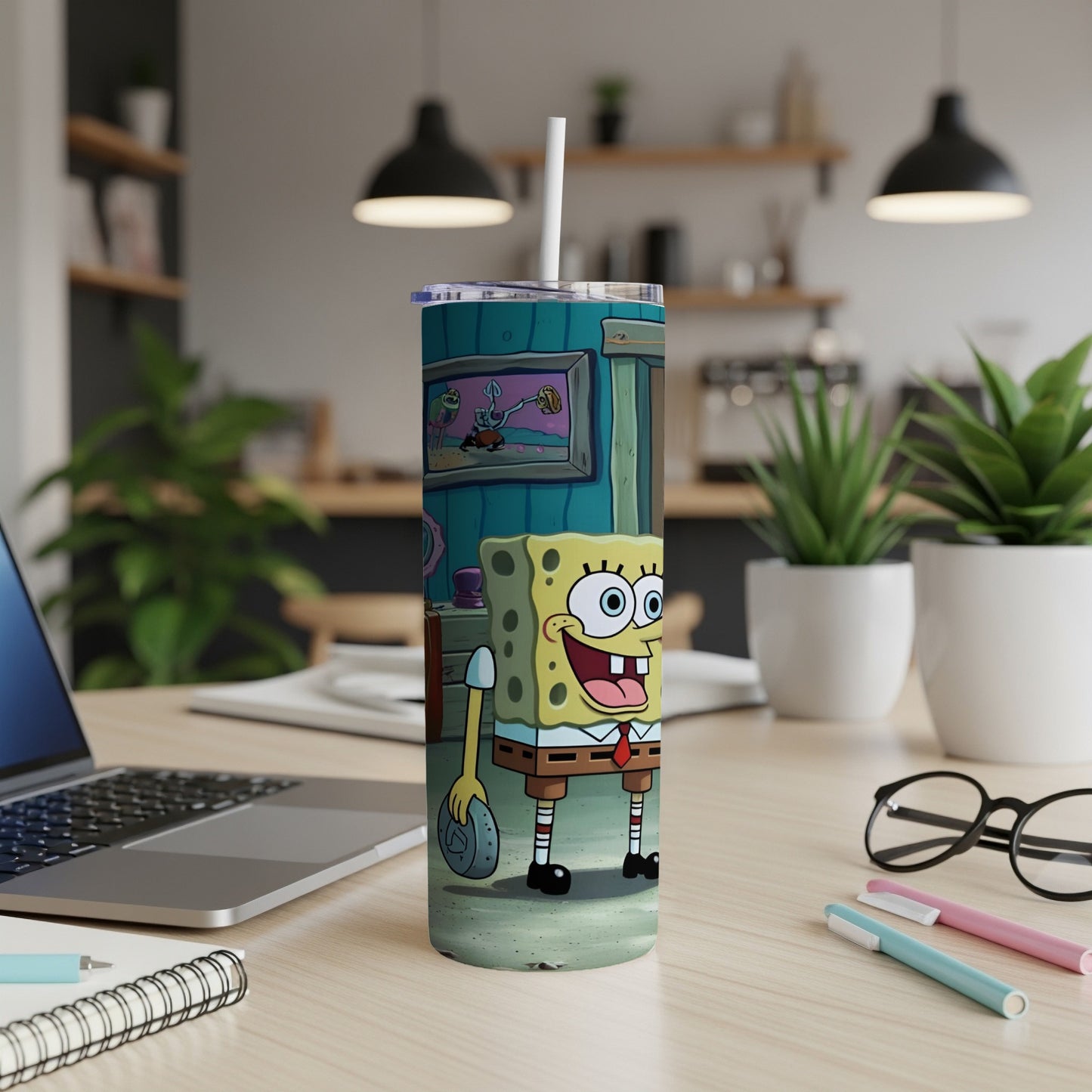 SpongeBob SquarePants character on a stainless steel tumbler with a straw.