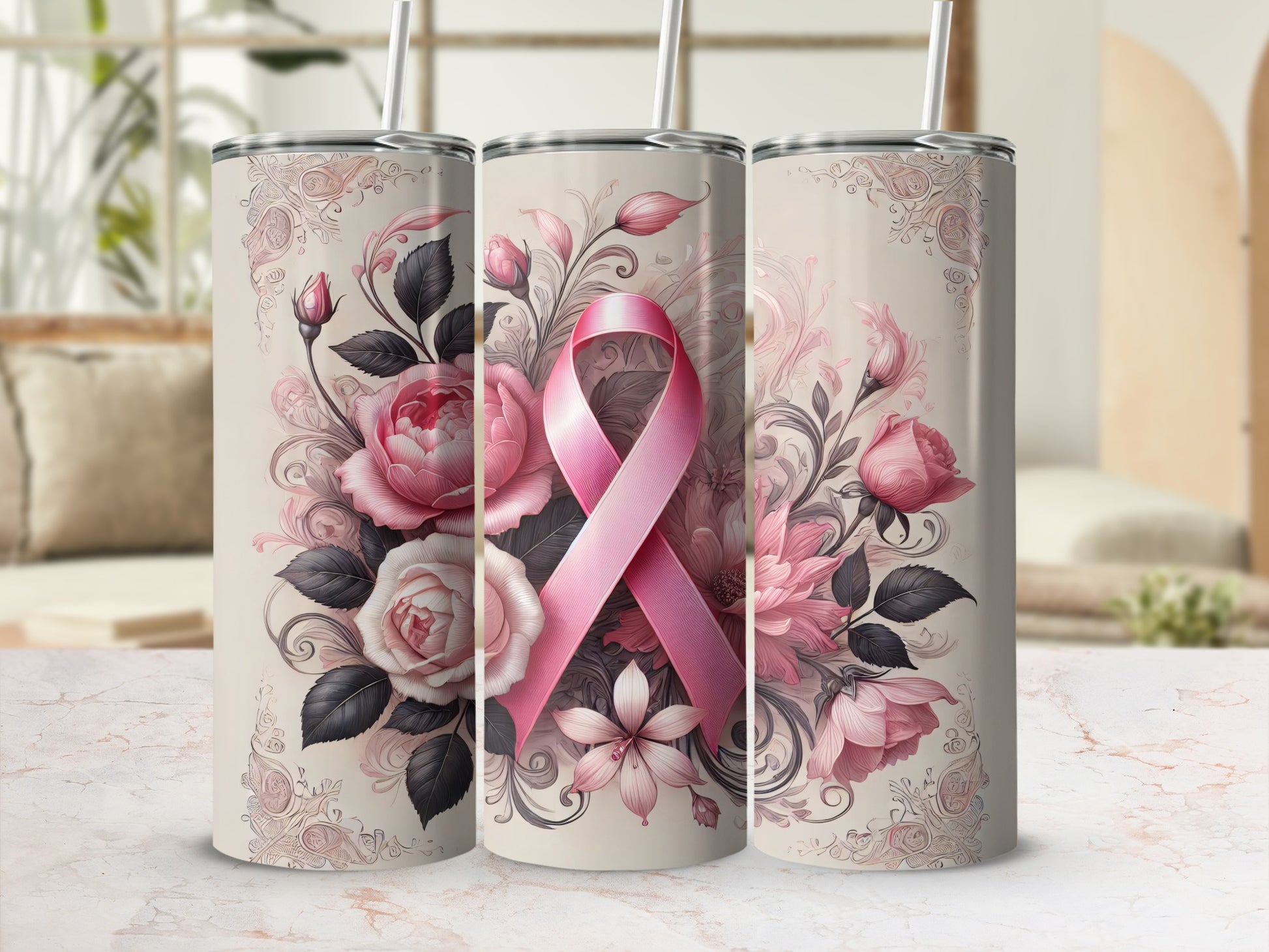 Pink ribbon and floral design on three stainless steel tumblers.