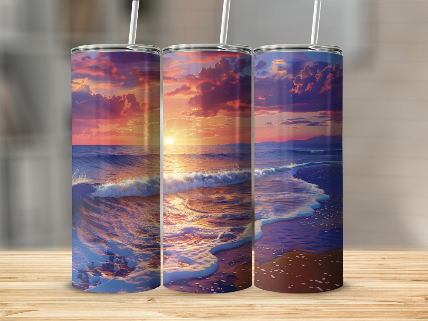 Three tumblers with a sunset beach scene, waves and clouds.