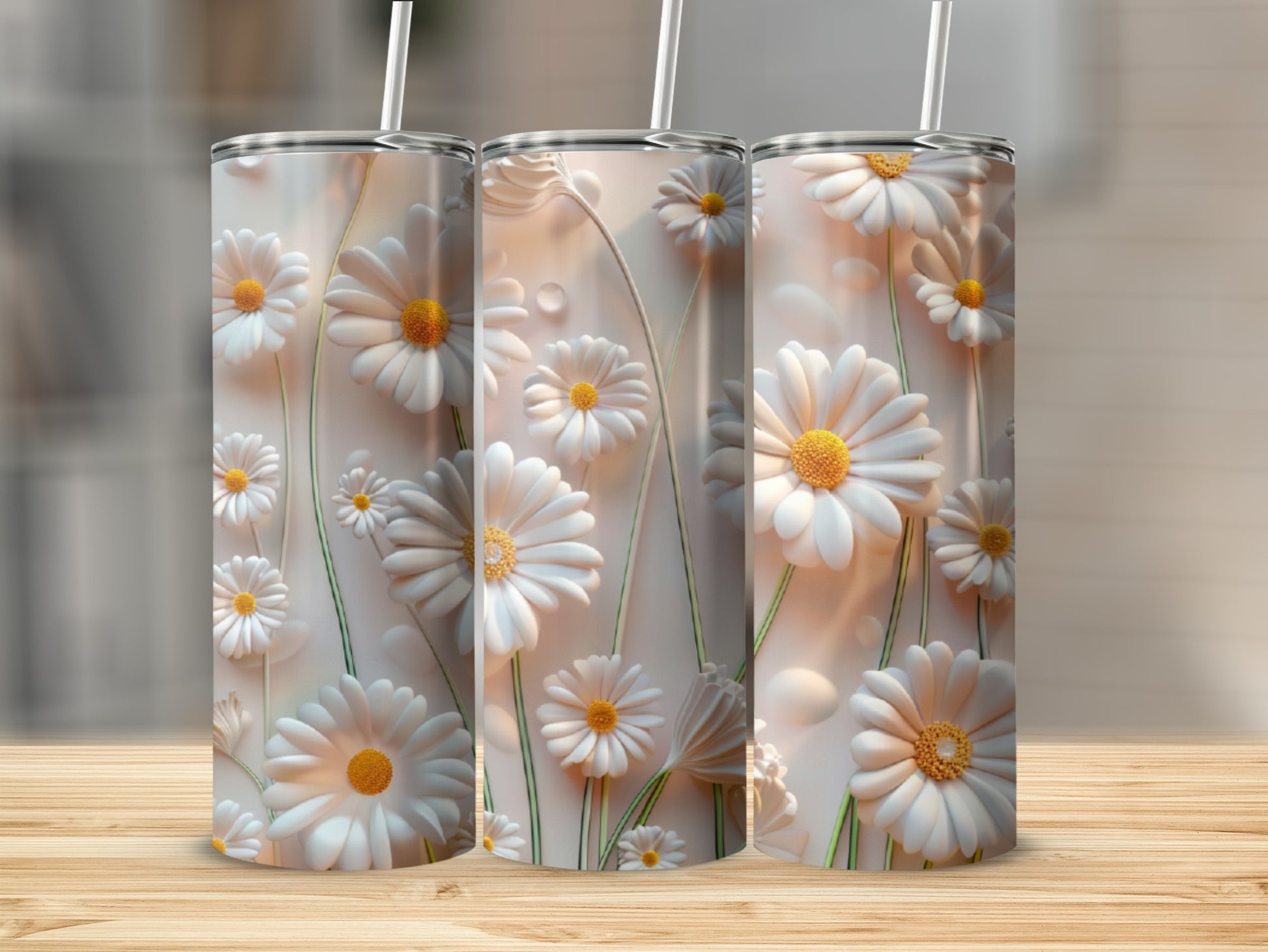 Three tumblers with white daisy floral design.