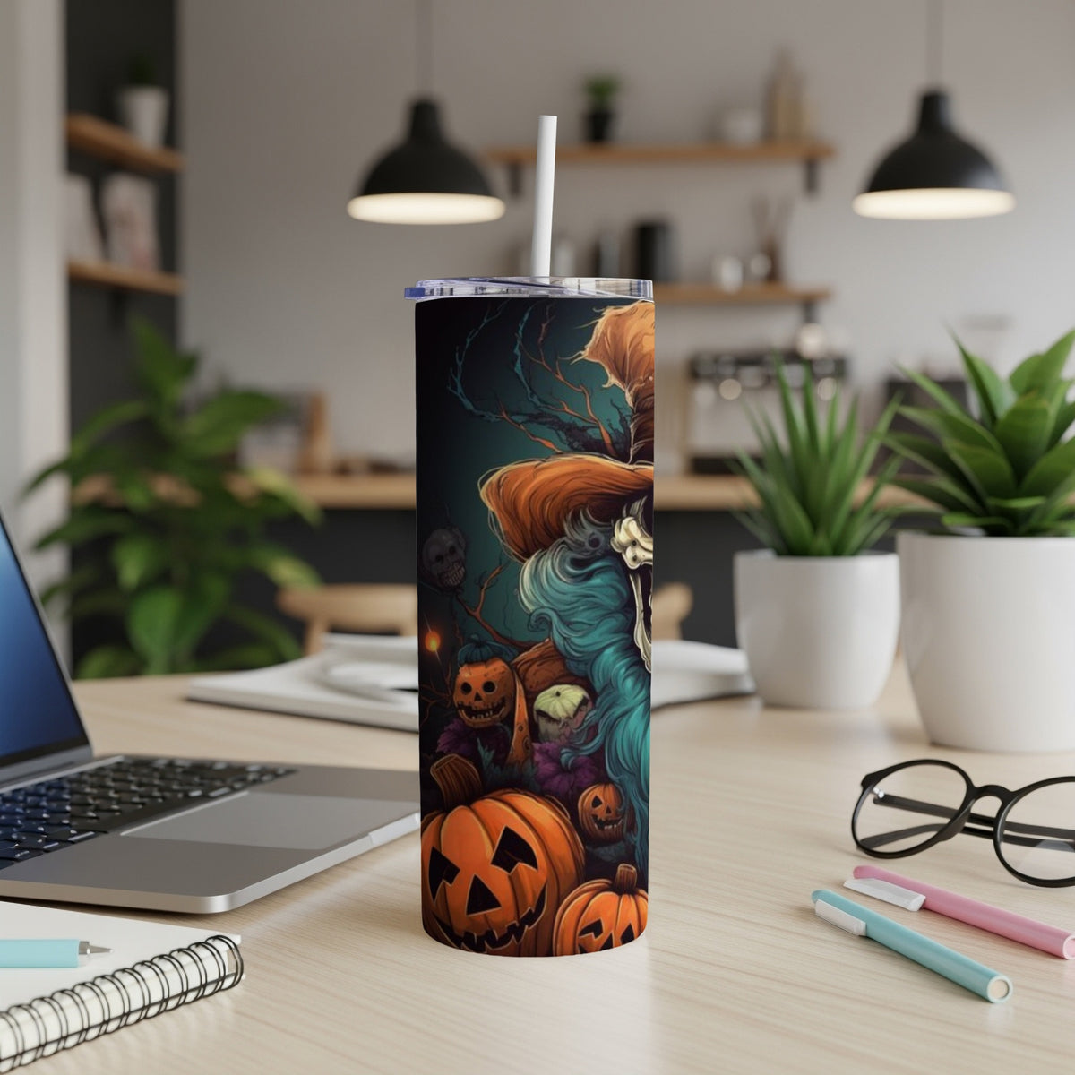 Halloween tumbler with jack-o'-lanterns and spooky figures in artistic illustration.