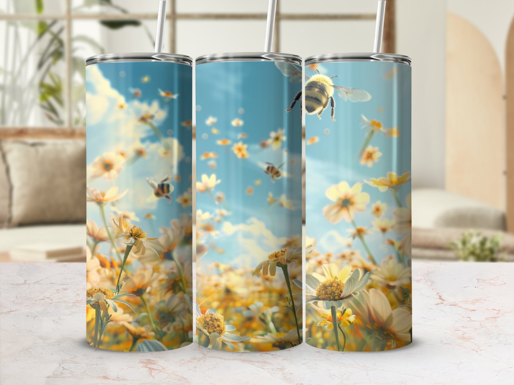 Three tumblers display a field of yellow daisies with bees in flight.