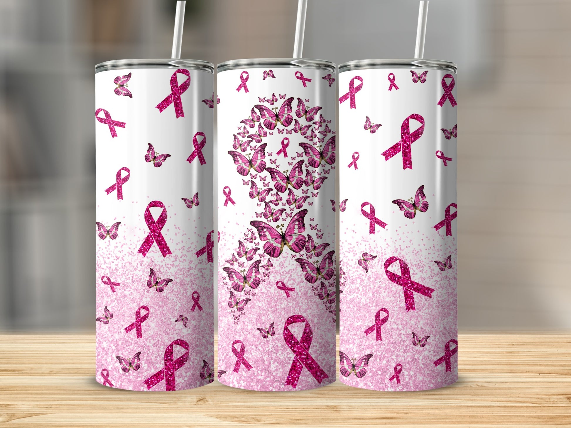 Three tumblers featuring pink breast cancer ribbons and butterflies.
