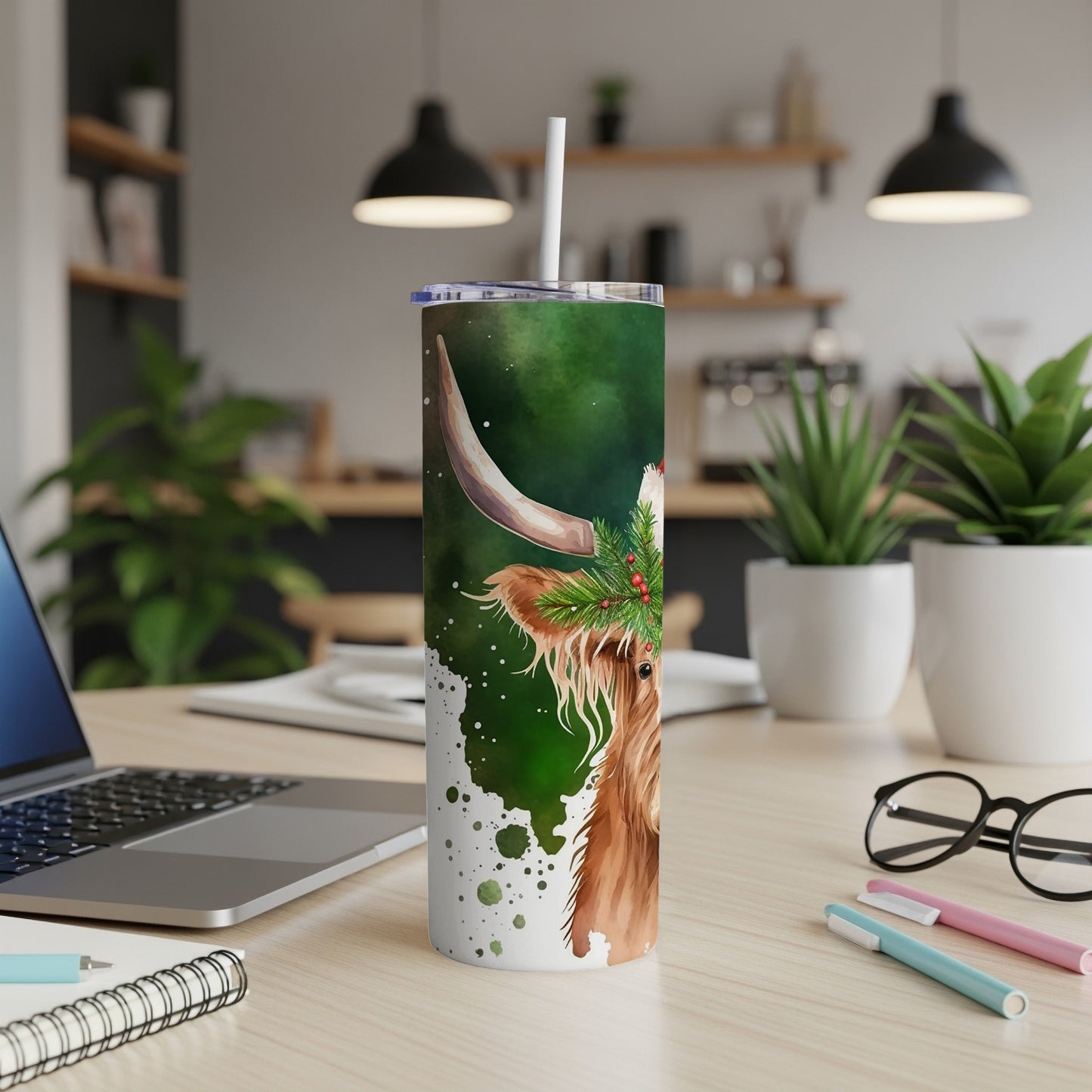 Green watercolor Highland cow tumbler with Santa hat and holly.