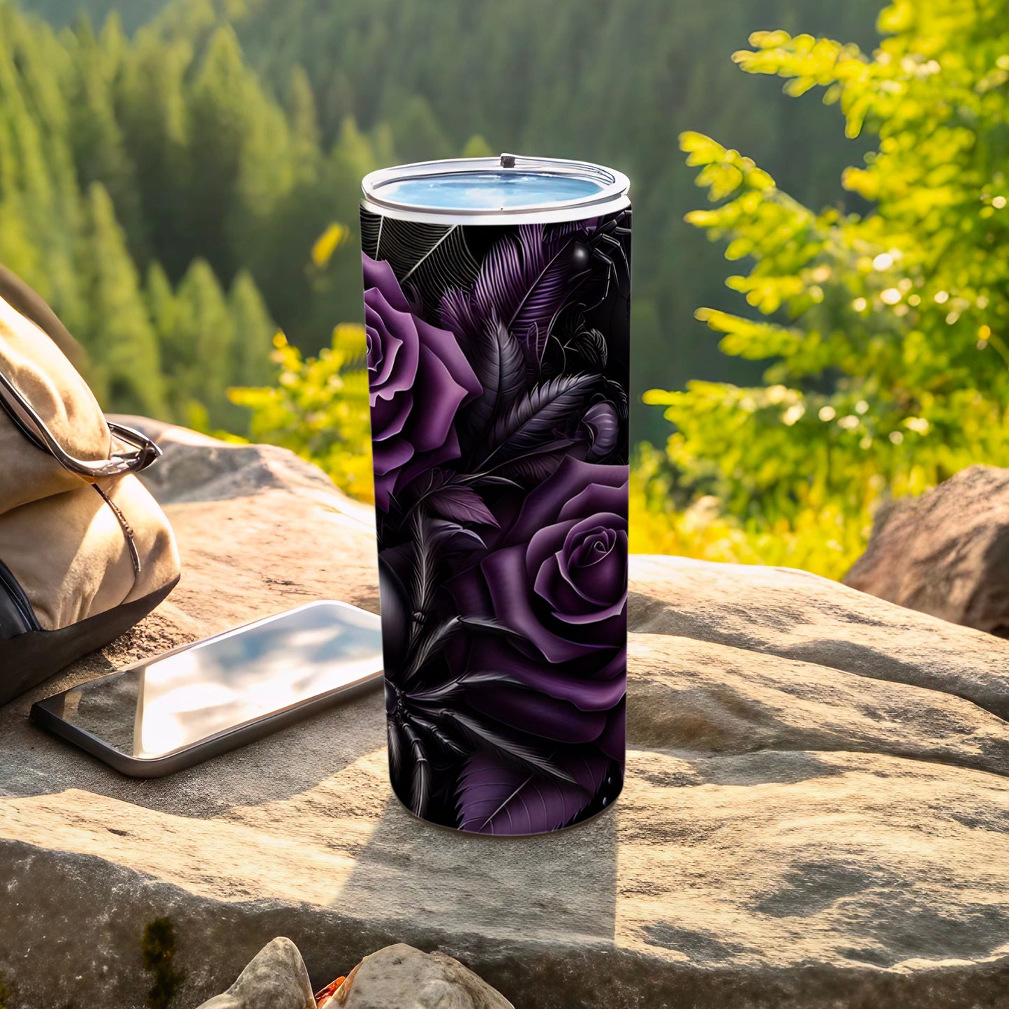 Purple roses and feathers pattern on a stainless steel tumbler.