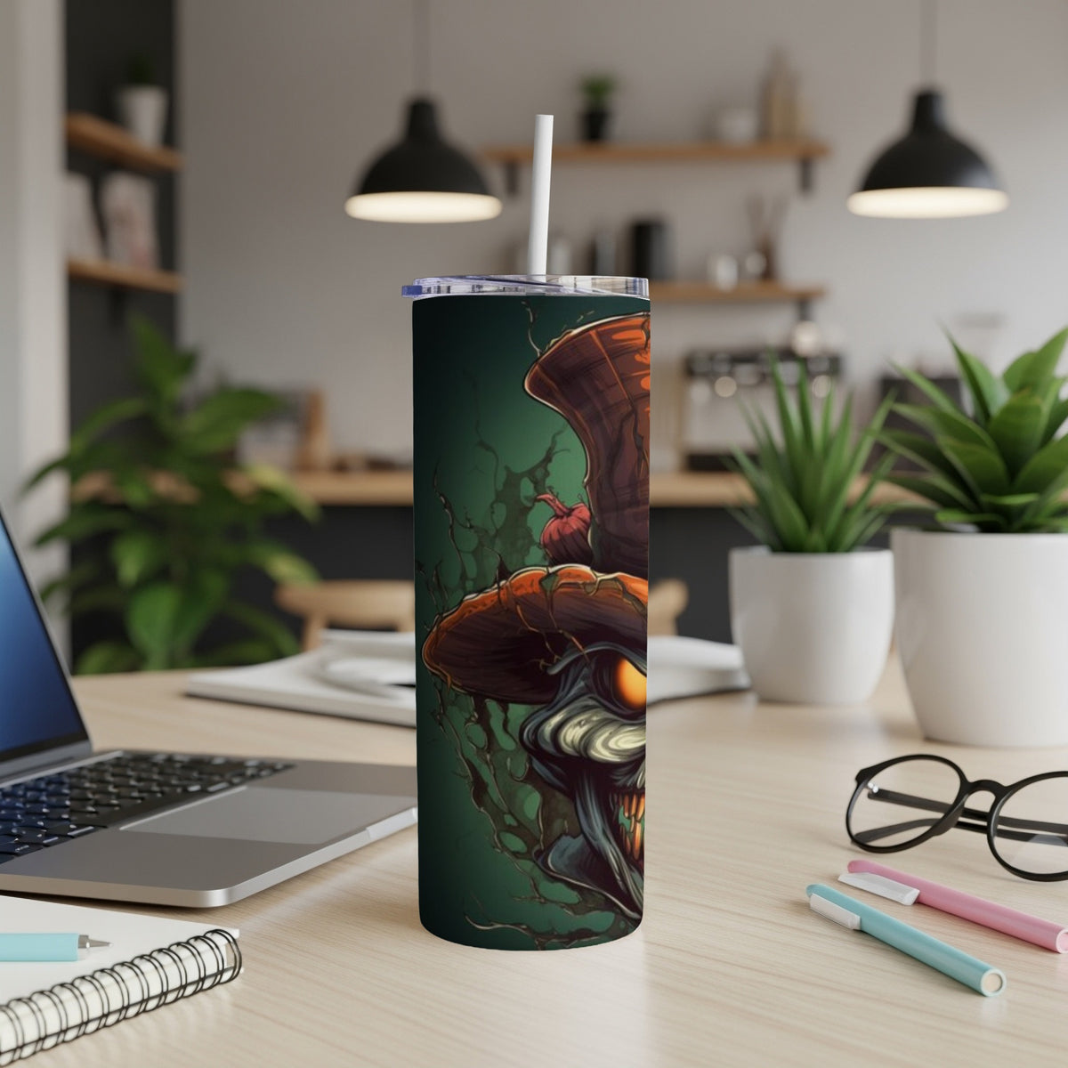 Tumbler with a spooky, grinning scarecrow design against a dark green background.