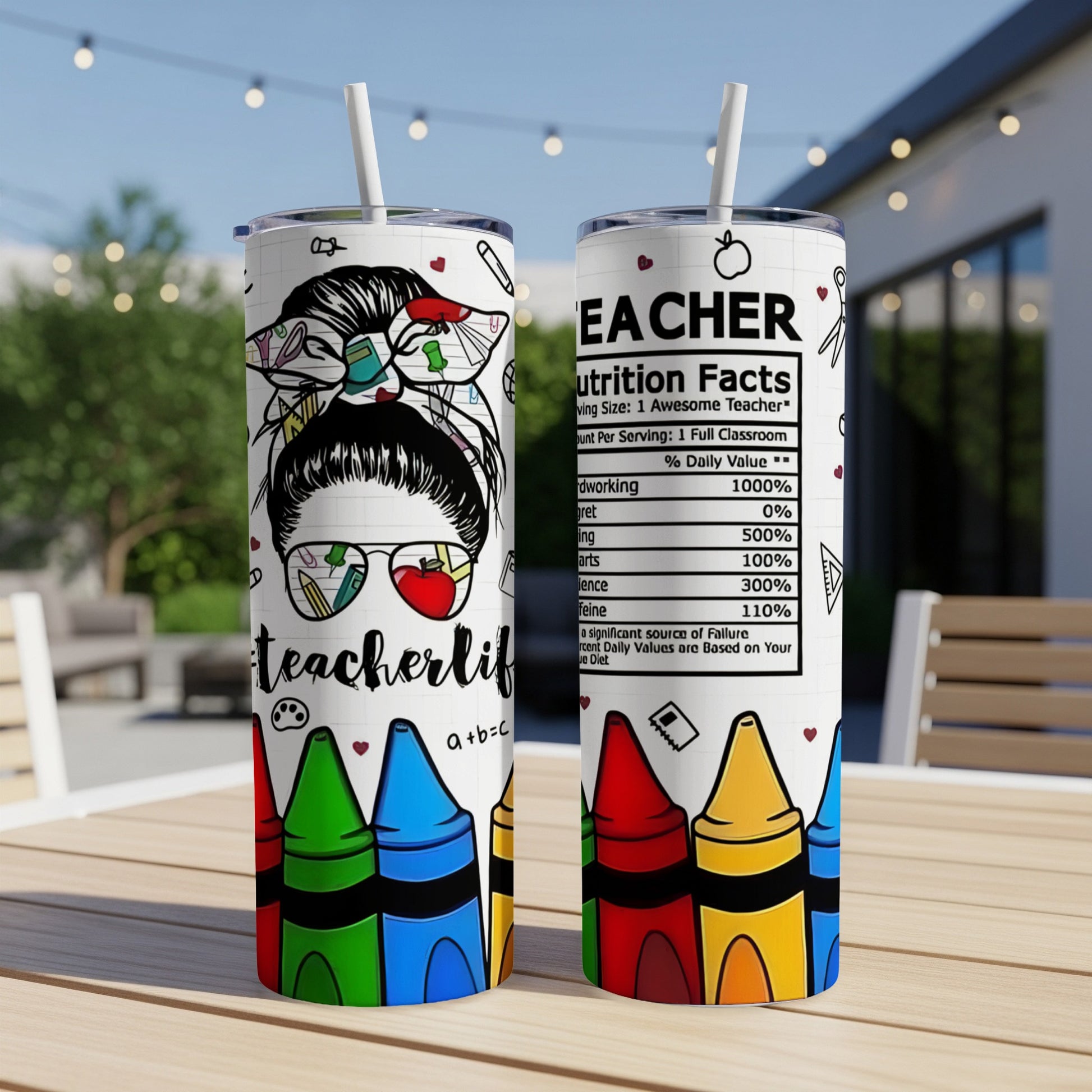 Teacherlife tumbler with nutrition facts label and colorful crayons.