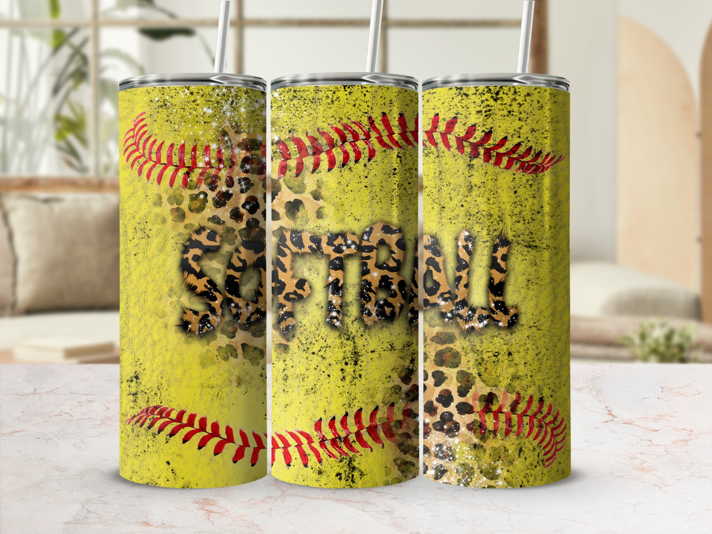 Yellow tumbler with softball graphic, leopard print, and red stitching.