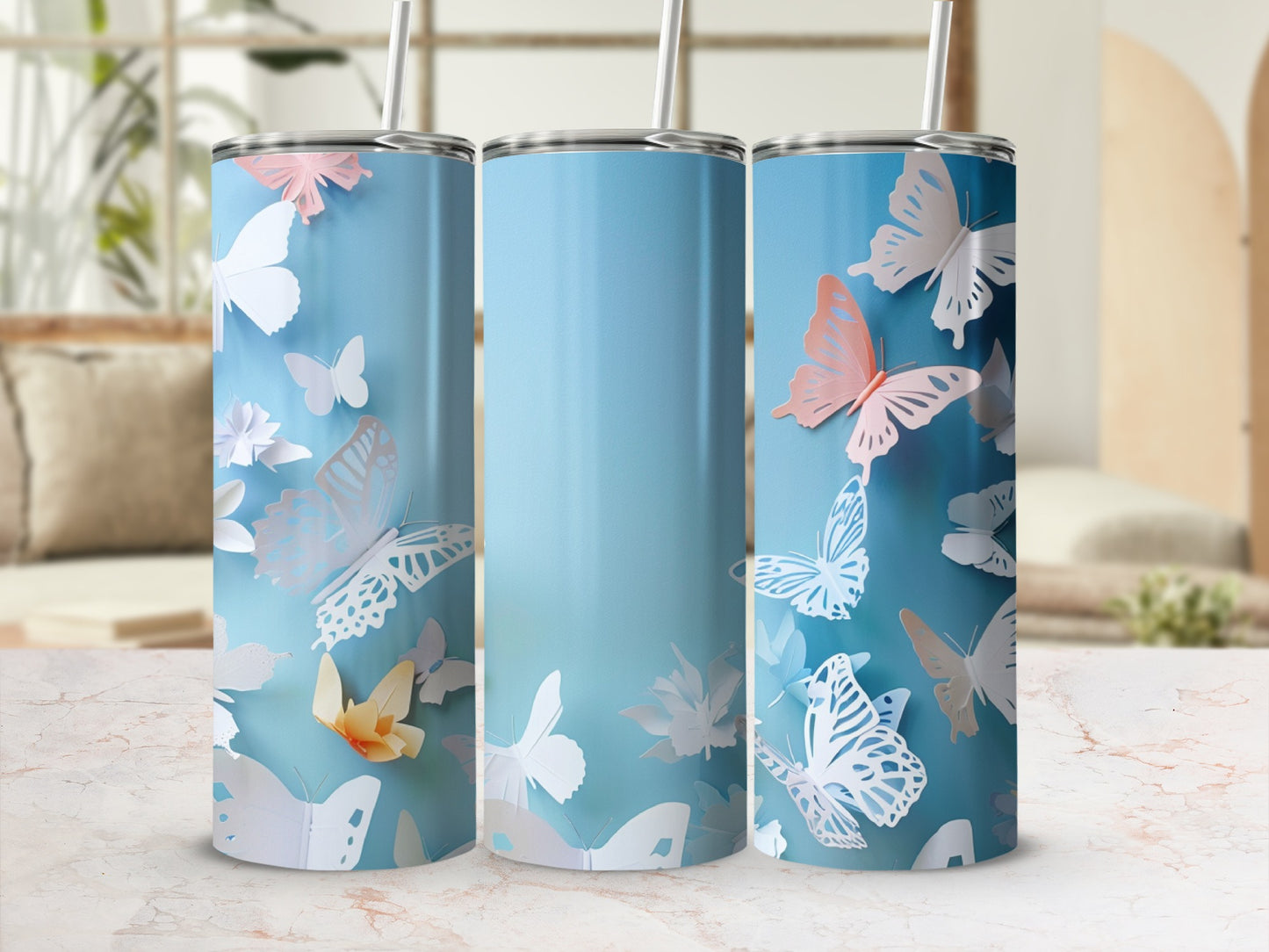 Blue tumbler with pastel butterflies and paper flowers.