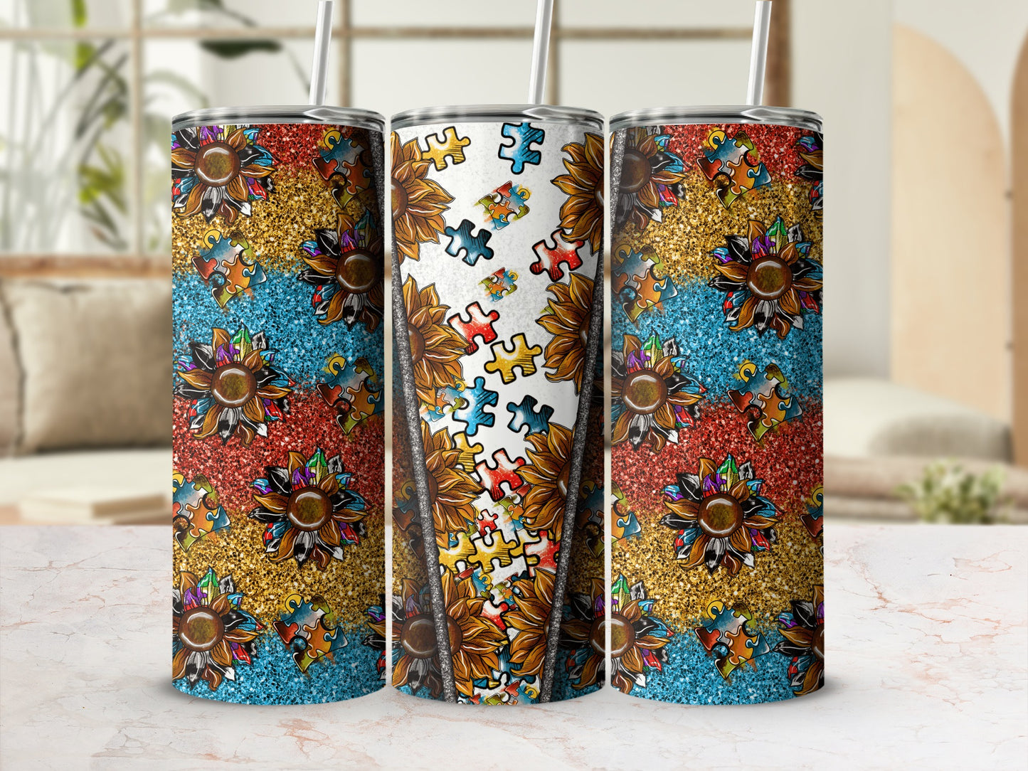 Three tumblers with sunflower and glitter puzzle piece designs.