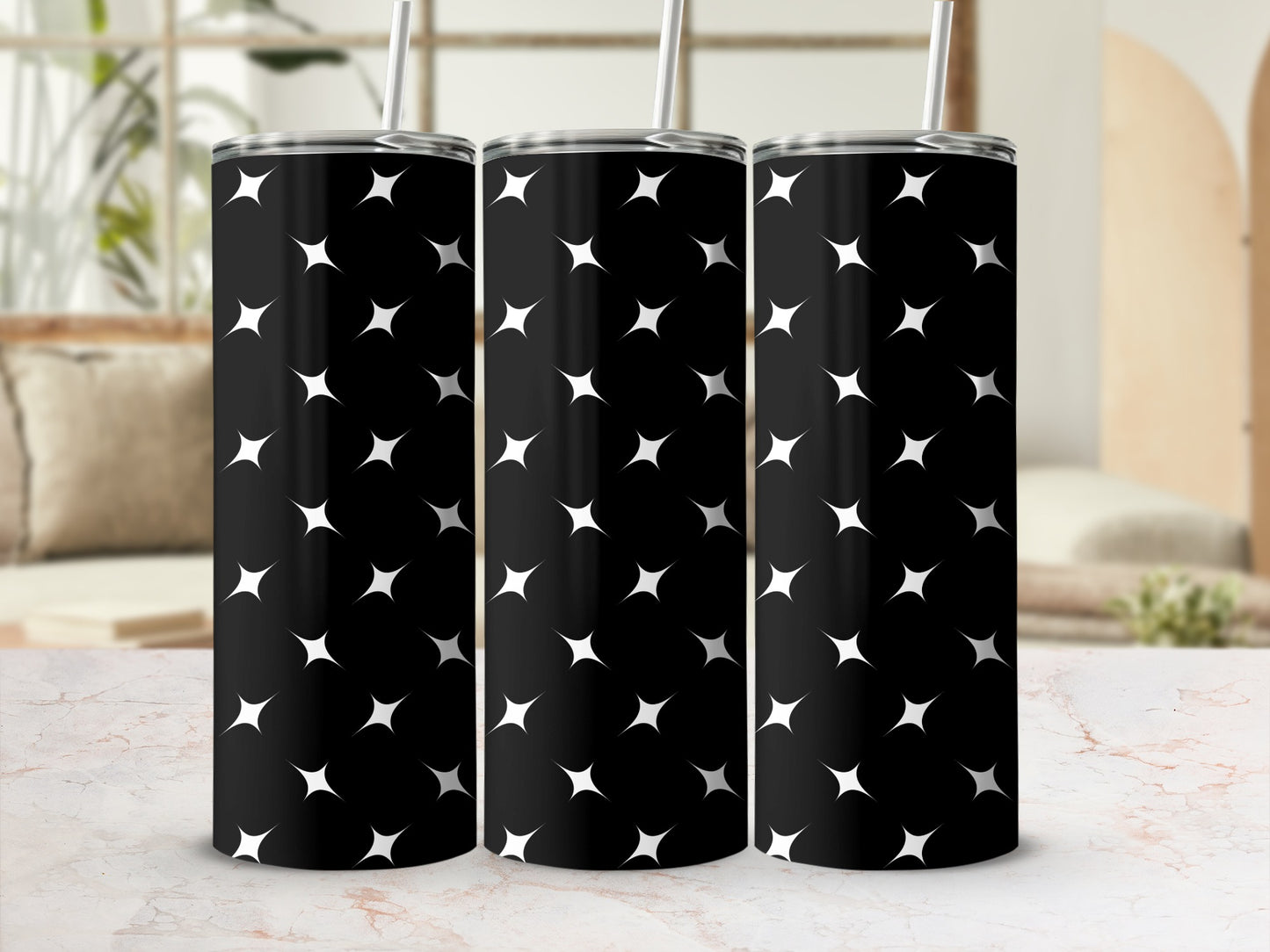Black tumbler with a repeating pattern of white starbursts.